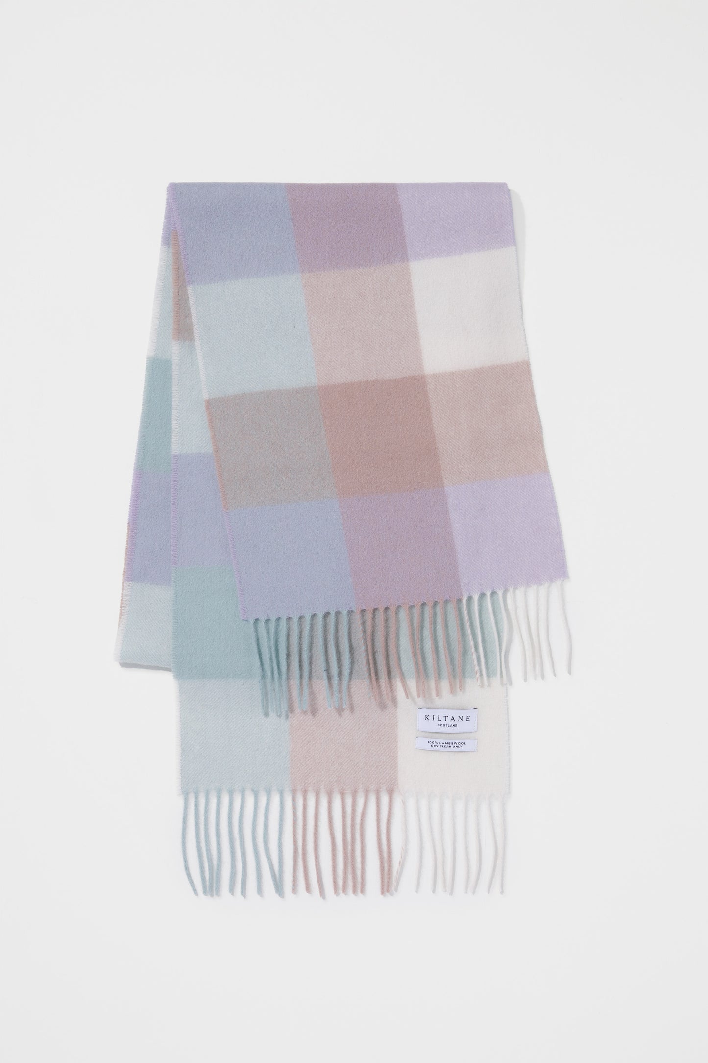 Kiltane 3 Square Check Lambswool Scarf in Brume Lilac, folded to show pastel check pattern with fringed ends