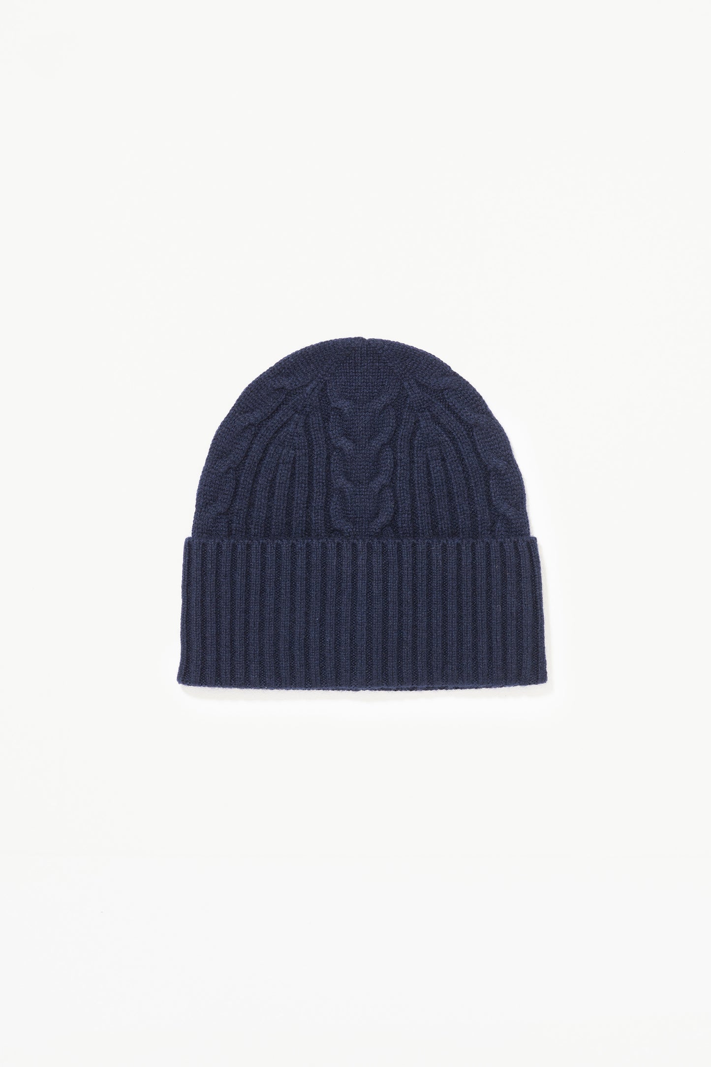 Cashmere Cable Beanie in Dark Navy laid flat, showing cable knit pattern on crown and ribbed fold-up cuff