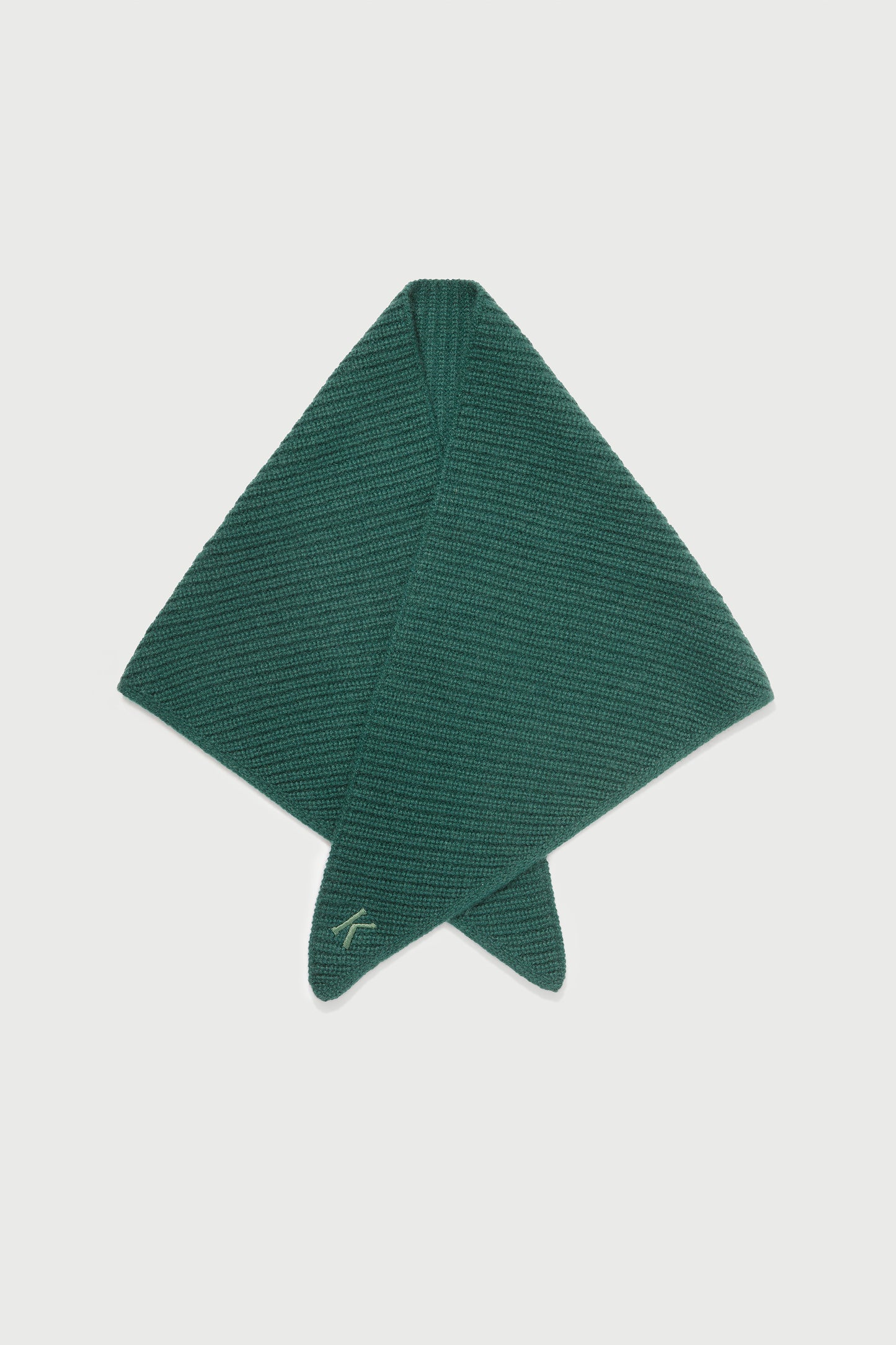 Knitted Cashmere Neck Tie in Forest Green laid flat showing diamond fold shape and embroidered logo at tip