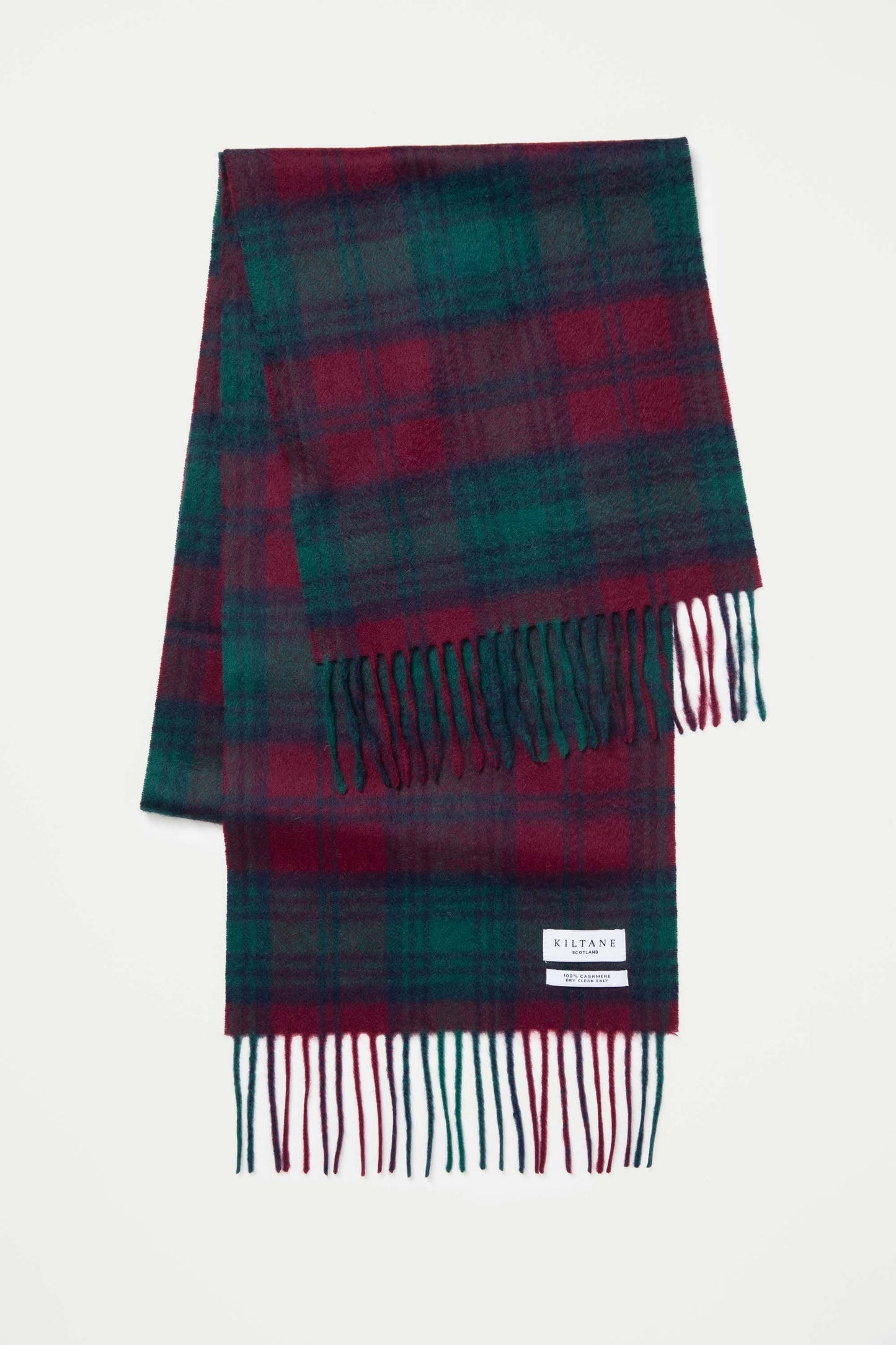 Heritage Tartan Cashmere Scarf - Lindsay folded flat showing deep red and green tartan pattern with fringed ends and Kiltane label