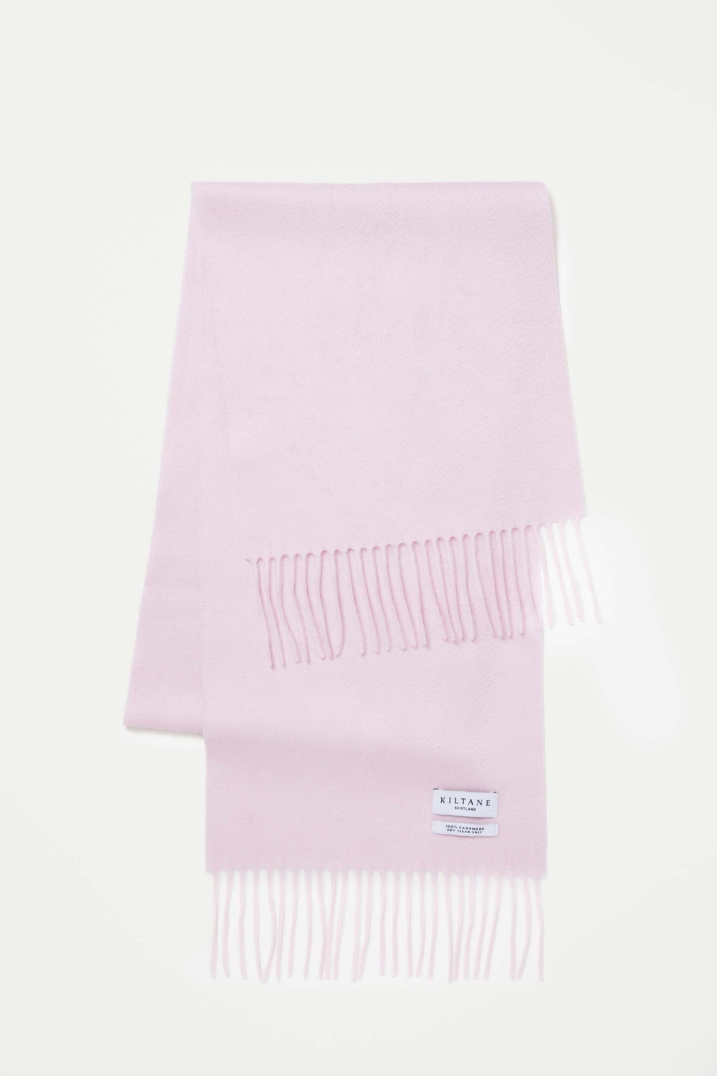 Kiltane Scotland Solid Cashmere Scarf in Pale Lilac folded flat showing fringed ends and 100% cashmere care label