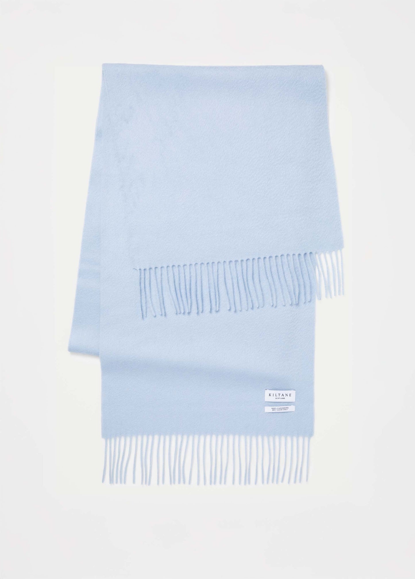 Kiltane Solid Cashmere Wide Scarf in Blue folded flat showing fringed ends and brand label