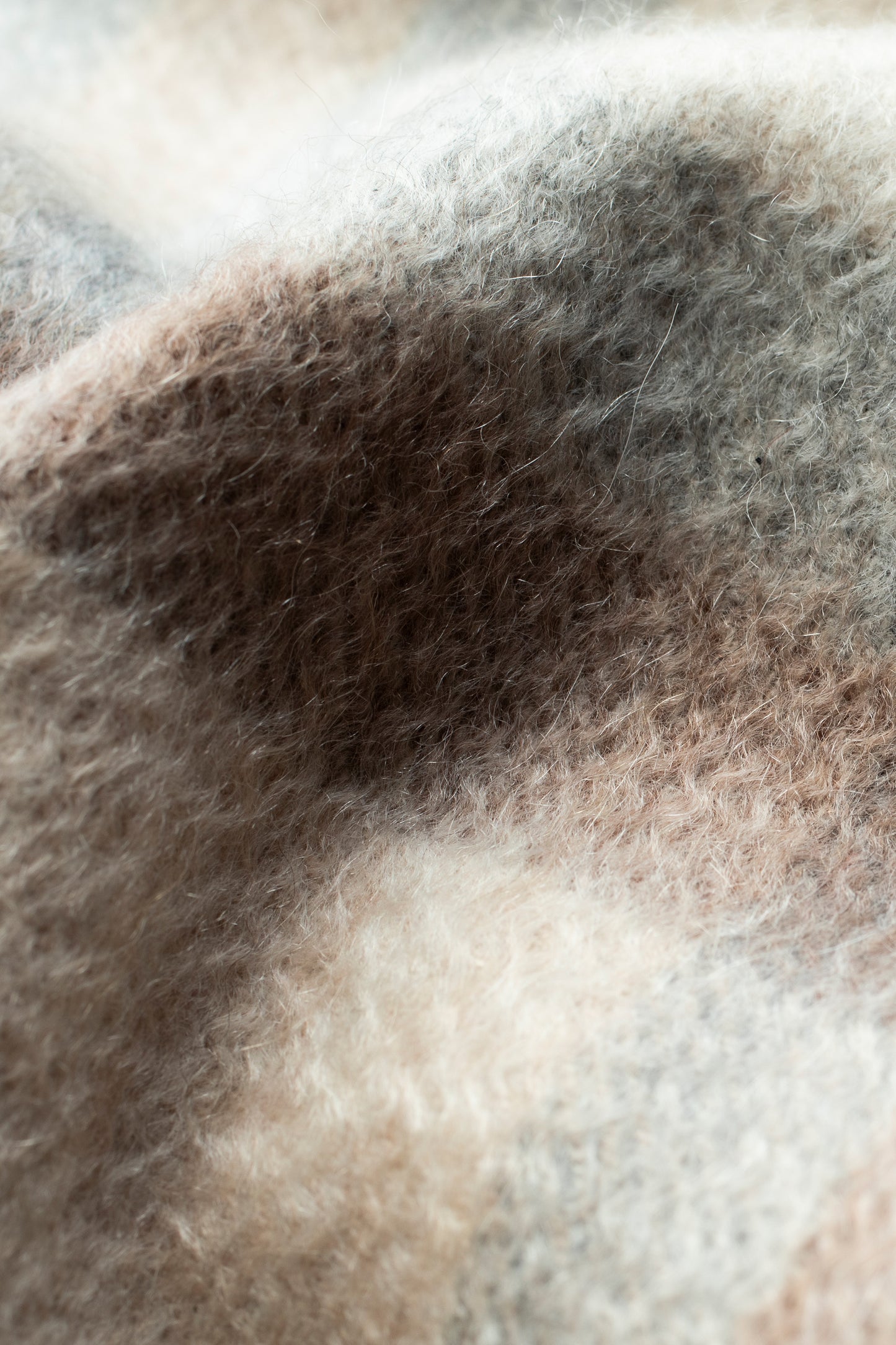 Close-up of Tartan 2 Cashmere Scarf in Natural showing soft brushed texture with brown, beige, and grey plaid pattern