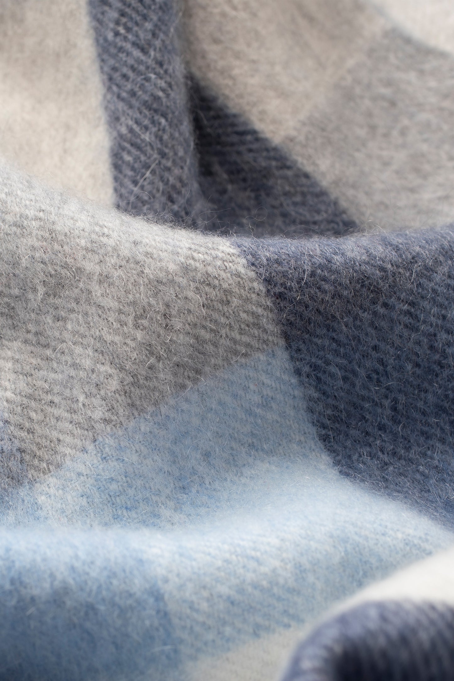 Close-up of 5 Square Check Cashmere Scarf in Glacier showing soft brushed texture in blue, grey, and light blue check