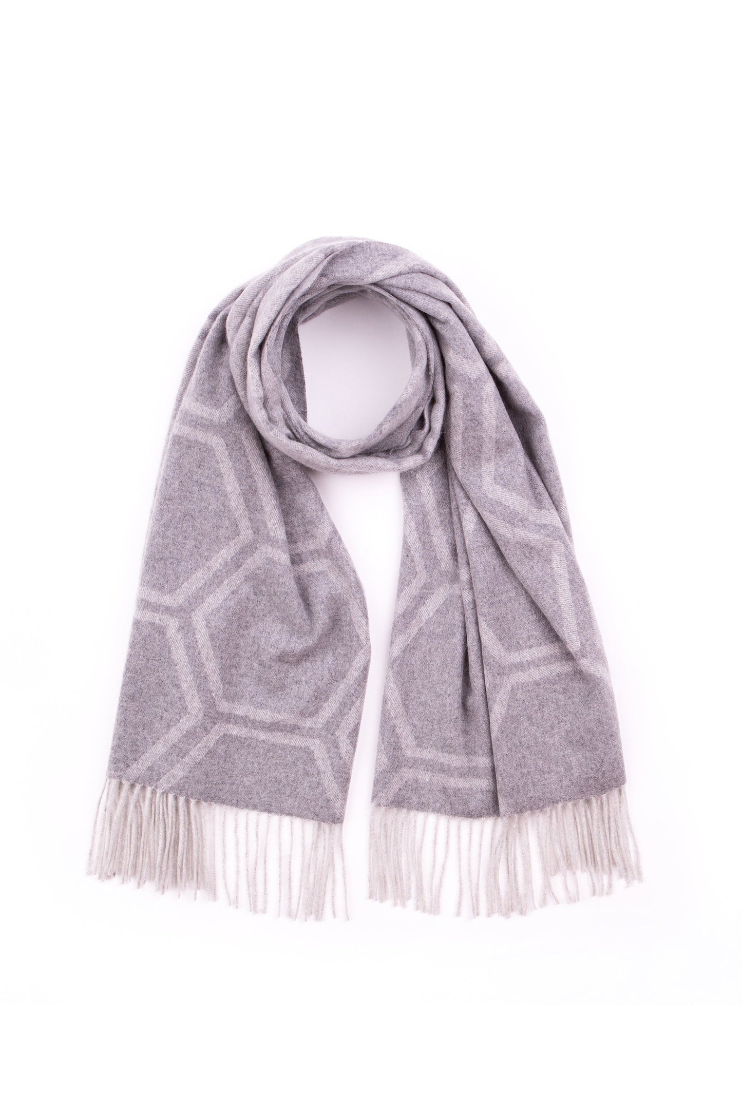 Jacquard Cashmere Geo Stole in light grey with geometric hexagonal pattern and fringed ends, draped in a loop