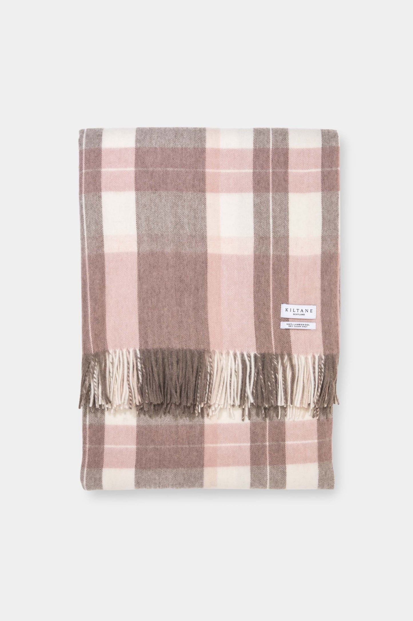 Kiltane Lambswool Throw in Cameo Check, folded to show pink, taupe, and cream plaid pattern with fringed edges