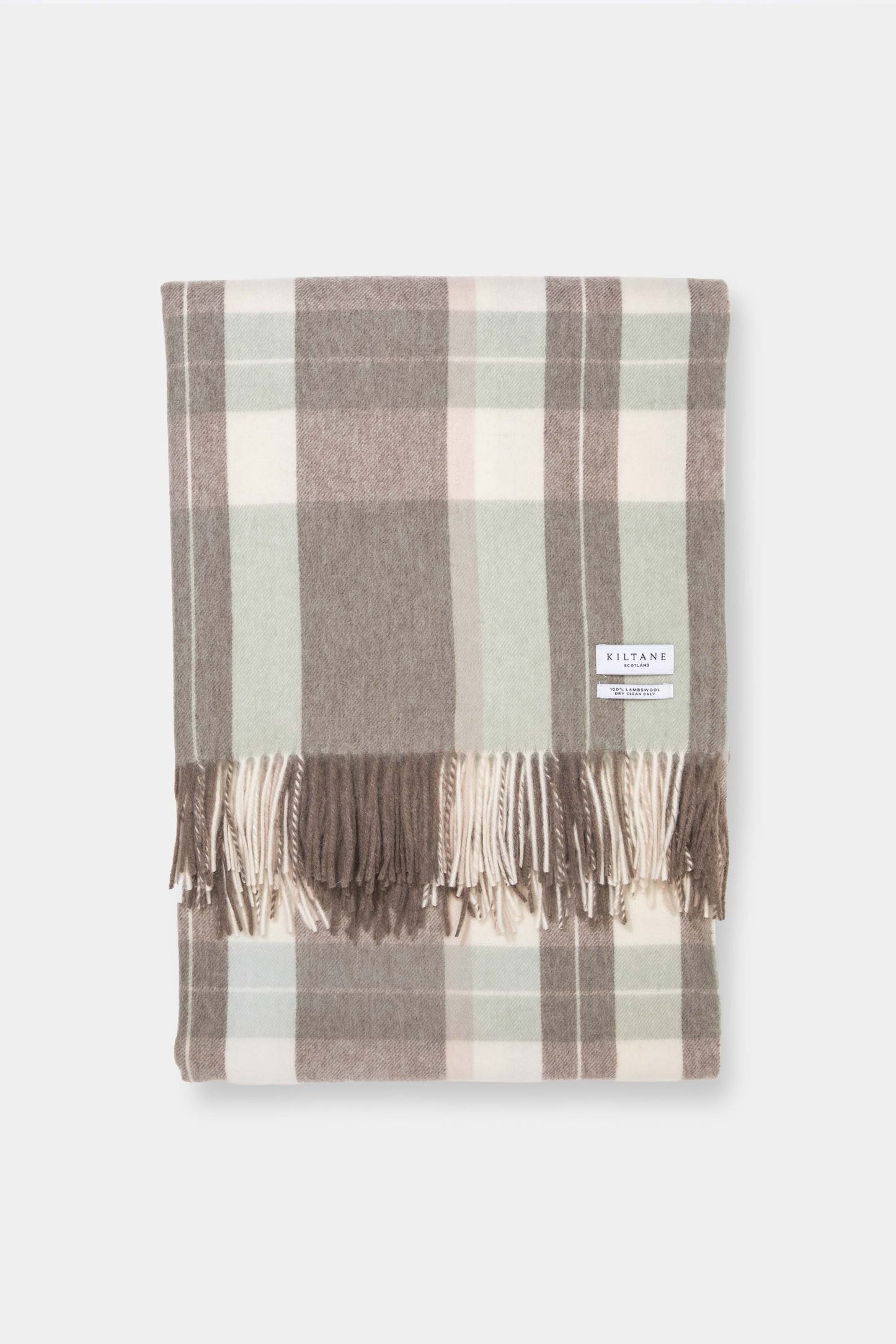Kiltane Lambswool Throw in Seafoam Check, folded to show soft plaid pattern in sage green, taupe, and cream with fringed edges
