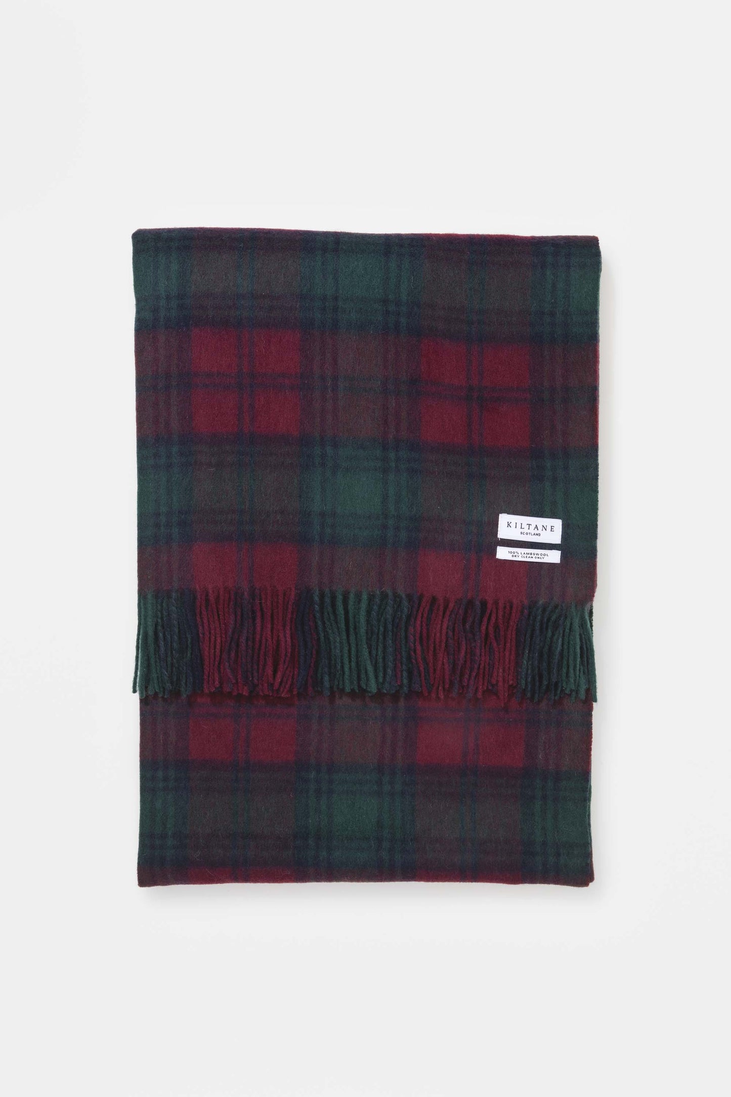 Kiltane Lambswool Throw in Lindsay tartan, folded flat showing deep red and green plaid pattern with fringed edges