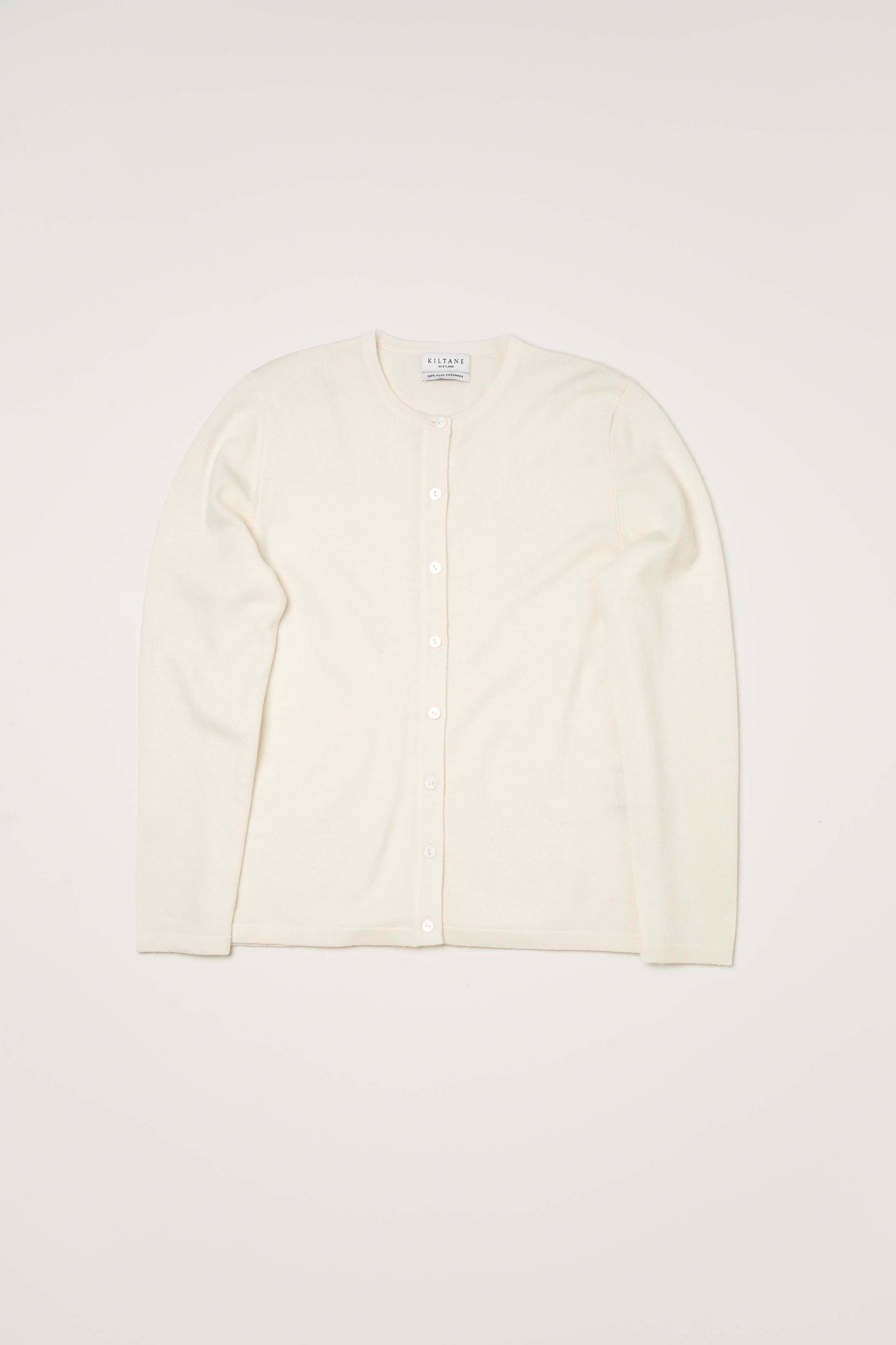 Kiltane Women's Cashmere High Button Cardigan in Soft Cream, flat lay front view showing full button placket