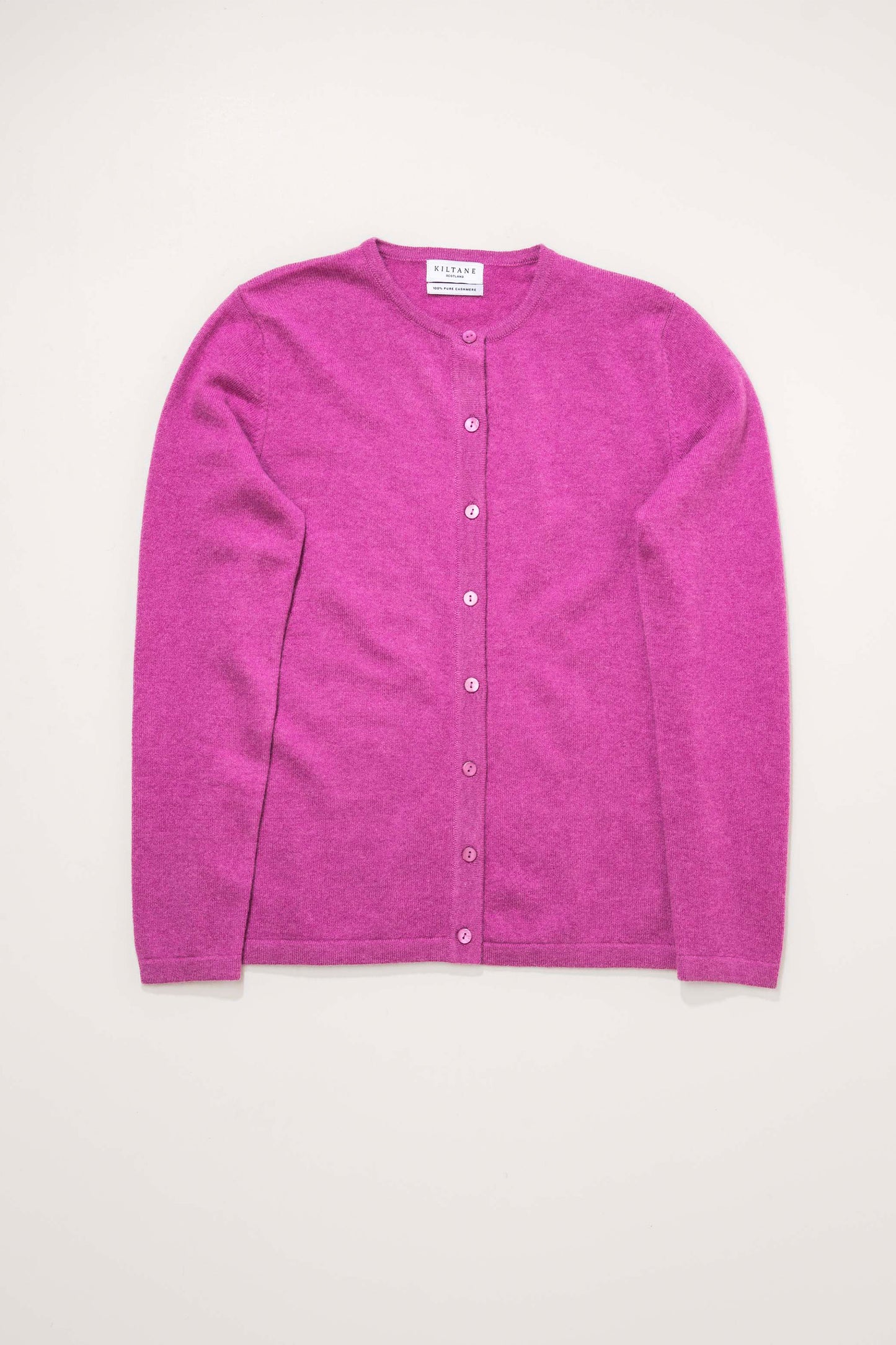 Kiltane Women's Cashmere High Button Cardigan in Raspberry laid flat, showing full front with button-up closure and round neckline