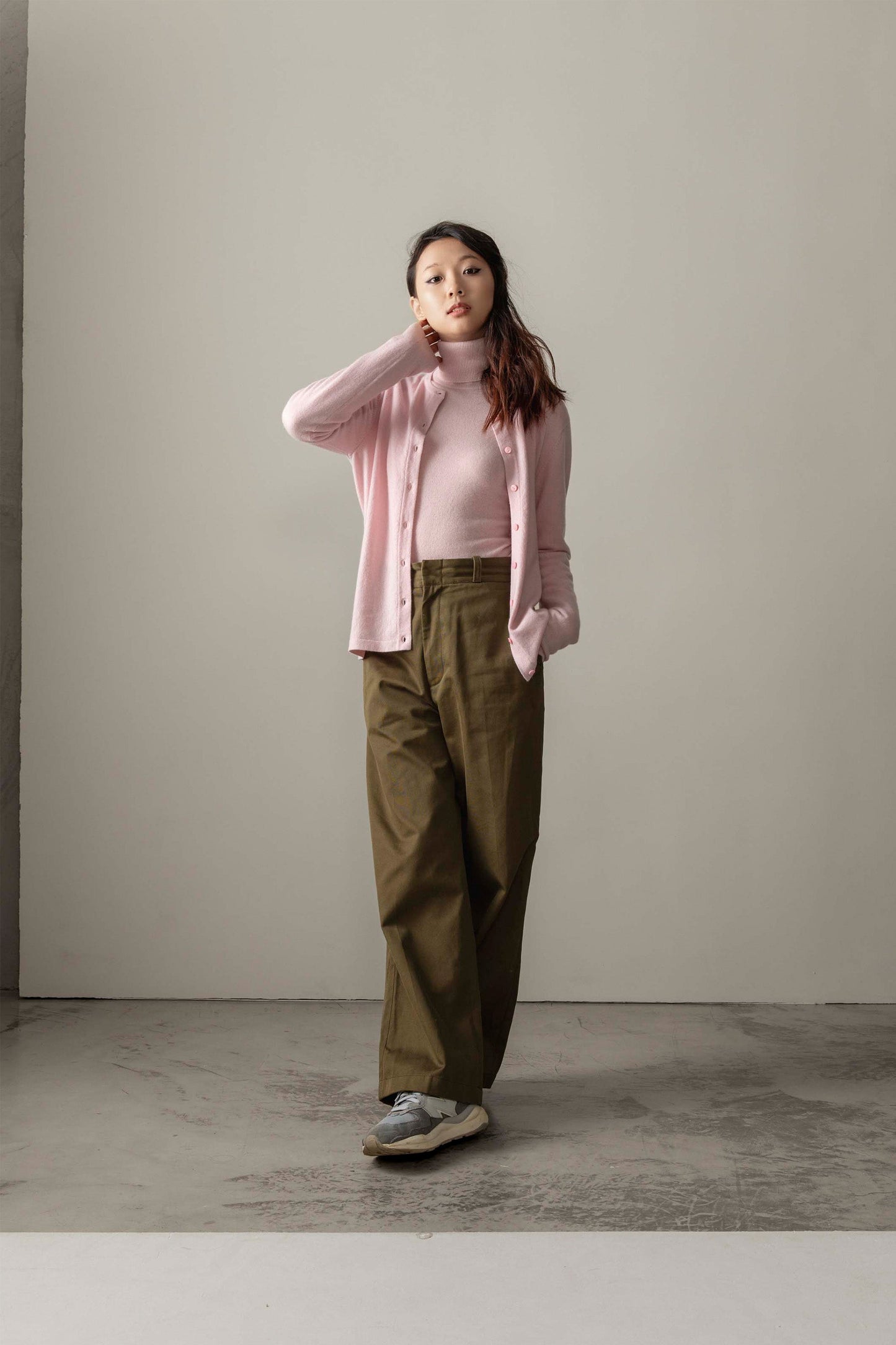 Women's Cashmere High Button Cardigan in Pale Lilac, worn open over a matching turtleneck with olive wide-leg trousers