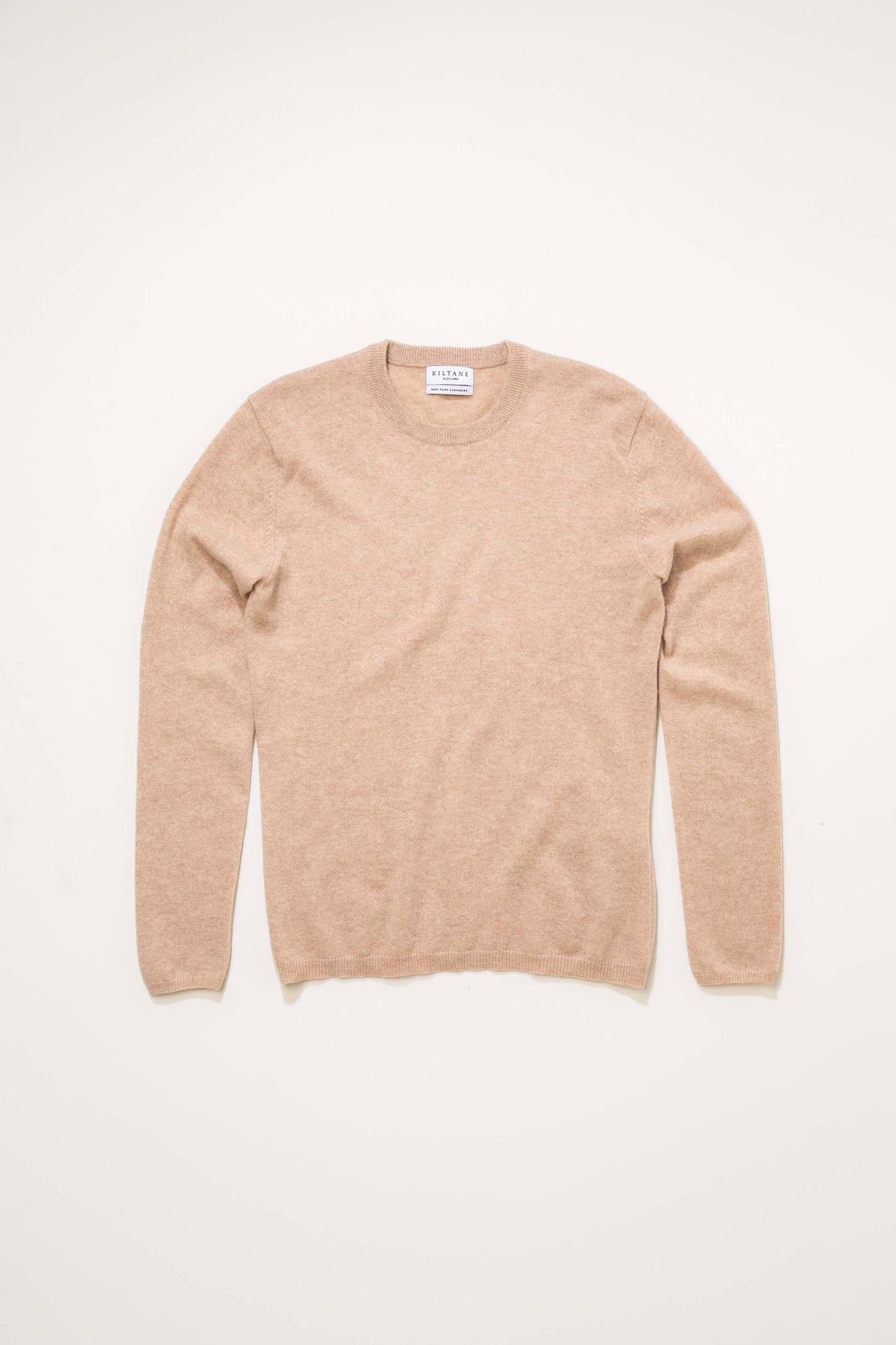 Kiltane Women's Cashmere Crew Neck Jumper in Vicuna laid flat, showing front view with ribbed cuffs and hem