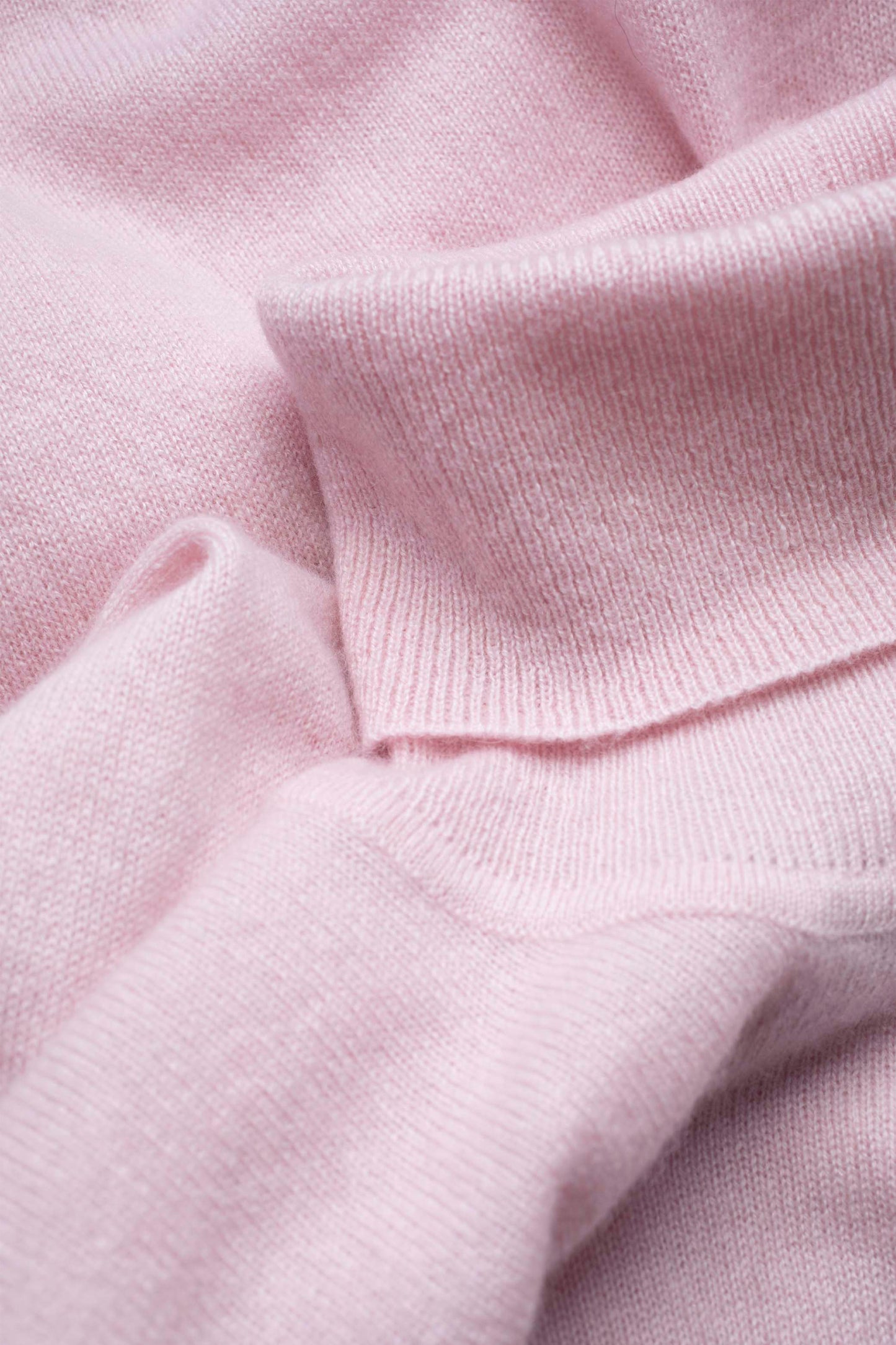 Close-up of the soft knit texture and fine gauge on the Women's Cashmere Polo Neck Jumper in pale lilac
