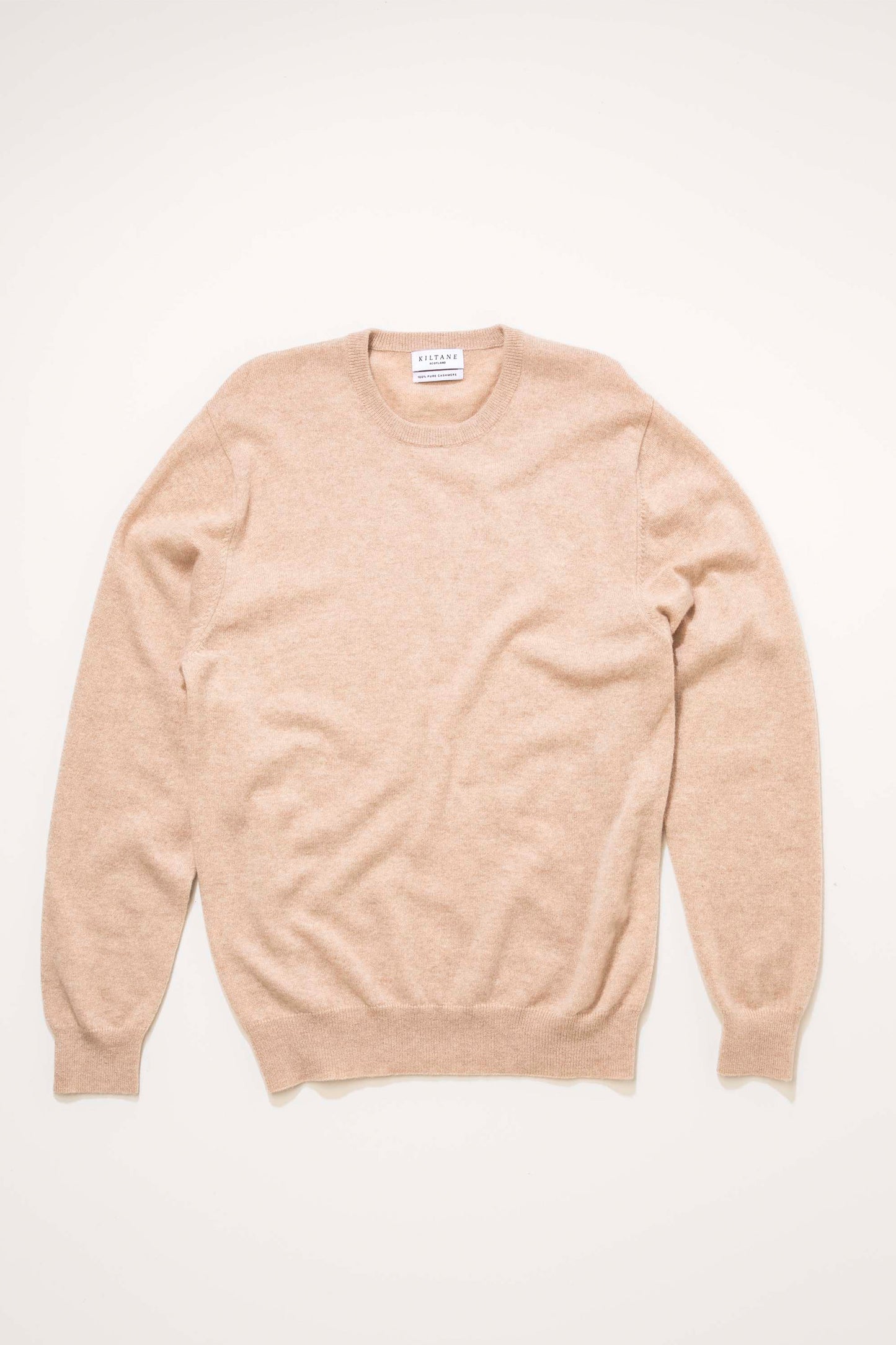Kiltane Men's Cashmere Crew Neck Jumper in Vicuna laid flat, showing full front view with ribbed cuffs and hem