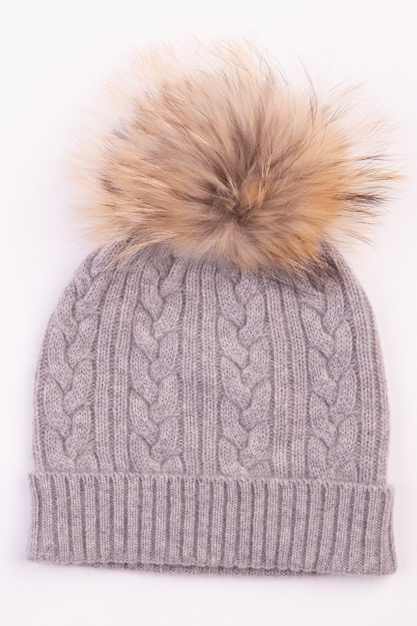 Cable Knit Pom Pom Hat in Oyster Grey — close-up of cable knit pattern with ribbed fold-over brim and natural fur pom pom
