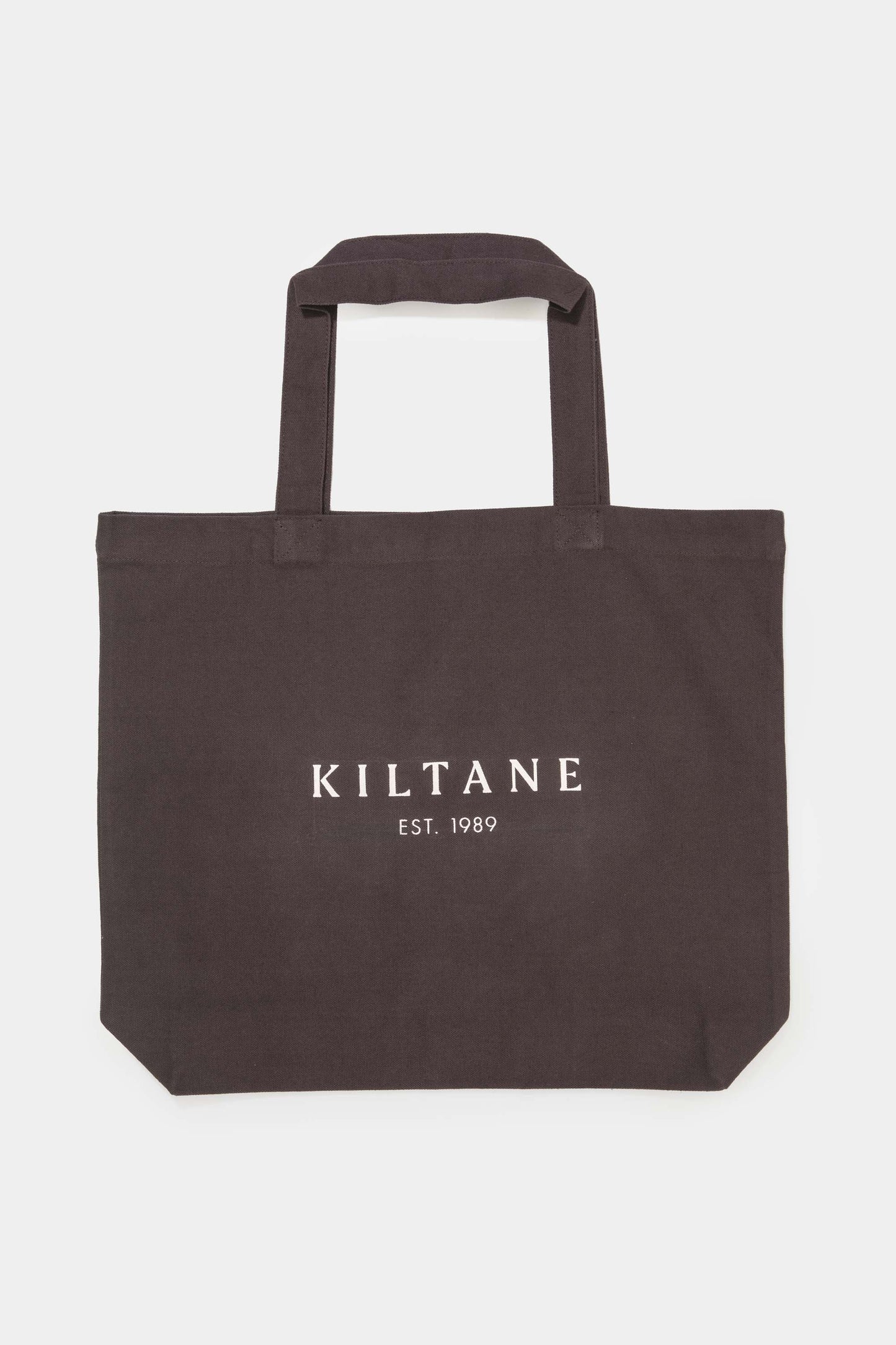 Kiltane Cotton Tote Bag in coffee brown with white Kiltane Est. 1989 logo, sturdy handles, and structured silhouette