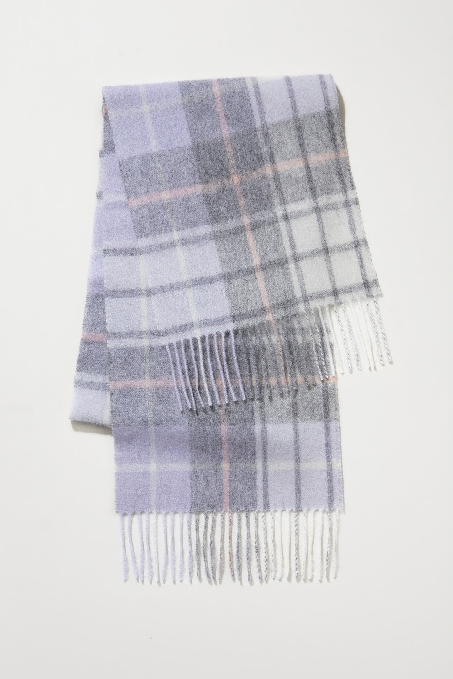Contemporary Check Lambswool Scarf in Moonshadow folded flat showing lavender, grey, and pink plaid pattern with fringed ends