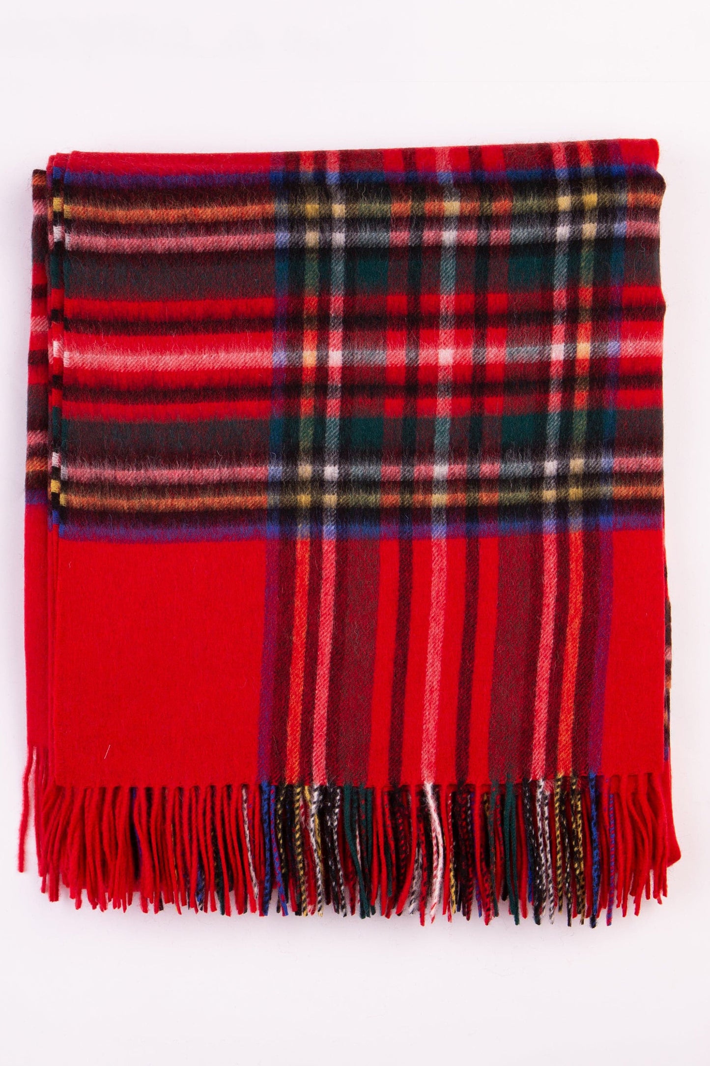 Lambswool Throw - Royal Stewart folded flat showing full red tartan pattern with green, blue, and yellow stripes and fringed edge