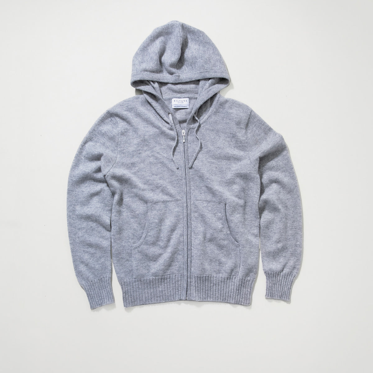 Kiltane Unisex Cashmere Zip Hoodie in Light Grey laid flat, showing front zip, patch pockets, and ribbed cuffs and hem