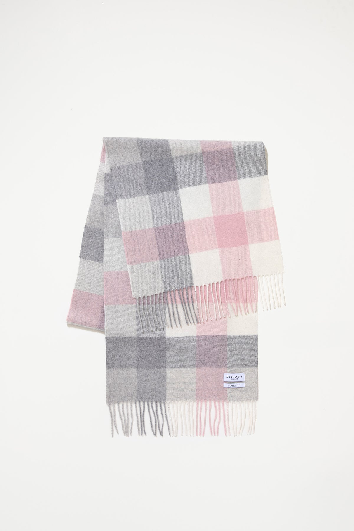 5 Square Check Cashmere Wide Scarf in Cherub folded to display pink, grey, and white check pattern with fringed ends and Kiltane label