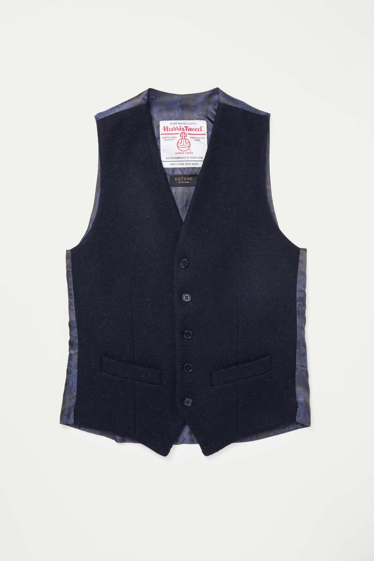 Harris Tweed Iain Waistcoat in dark navy twill laid flat, showing front with five-button closure, welt pockets, and paisley lining
