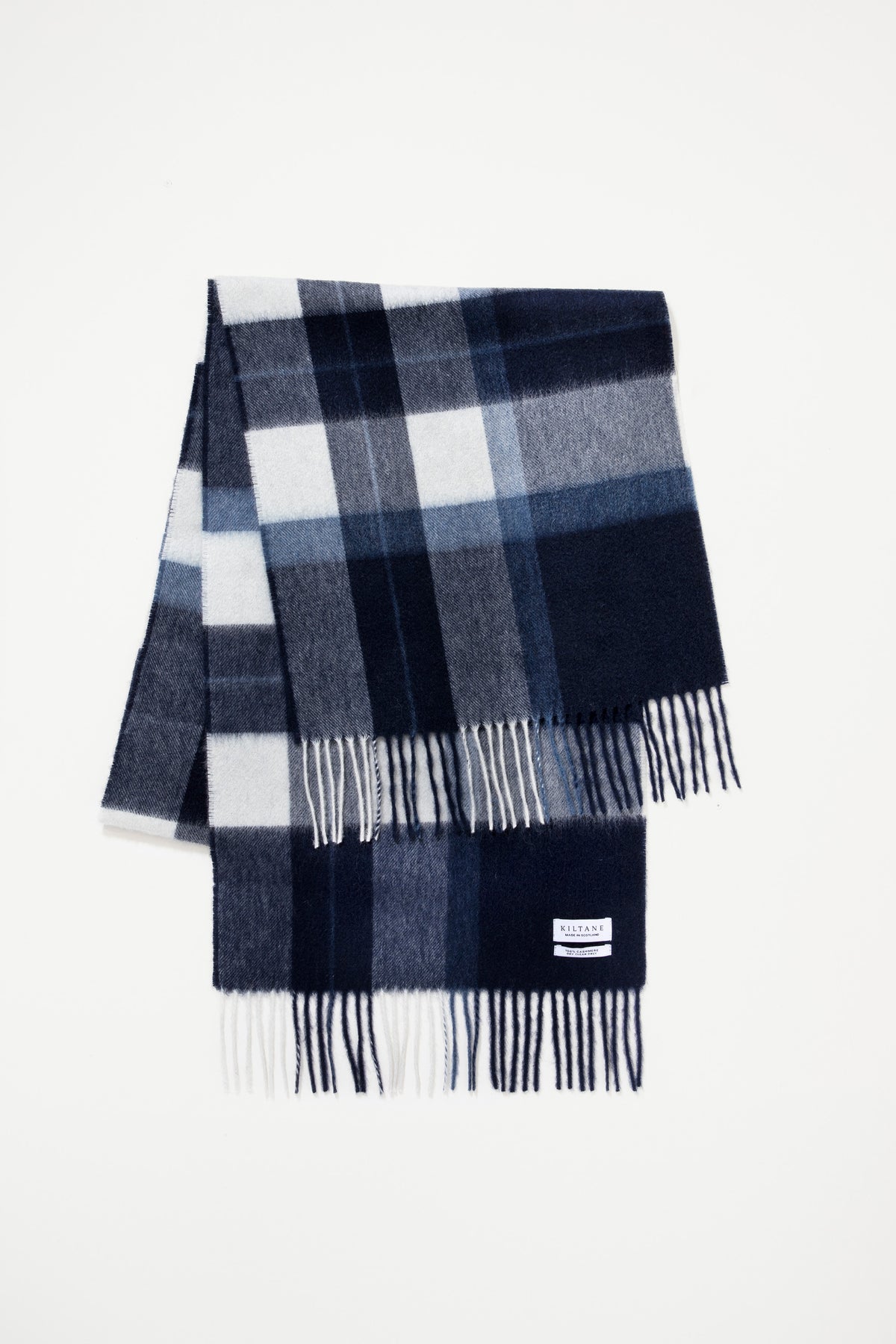 Kiltane Chatham Navy cashmere wide scarf folded to show check pattern with navy, grey, and white blocks and fringed ends