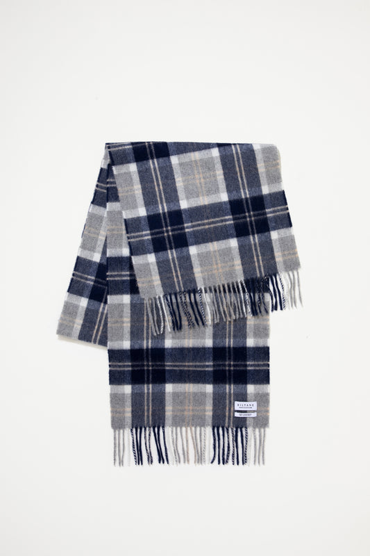 Heritage Cashmere Wide Scarf in Silver Bannockbane folded flat showing navy, grey, and white plaid pattern with fringed ends and Kiltane label