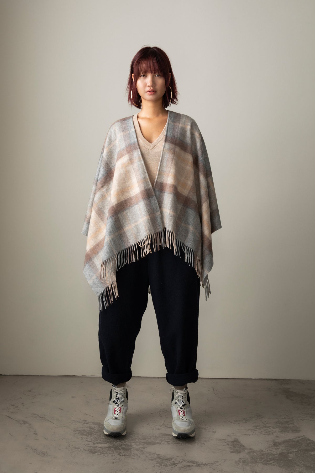 Heritage Tartan Cashmere Wrap - Mackellar Natural worn open over a V-neck sweater, showing full drape and fringed hem