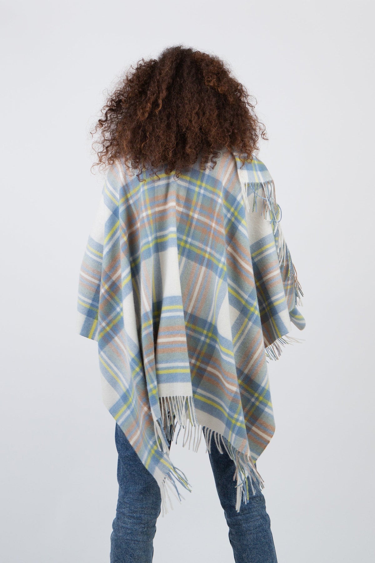 Back view of the Heritage Tartan Lambswool Wrap in Muted Blue Dress Stewart, showing full drape and fringed edges