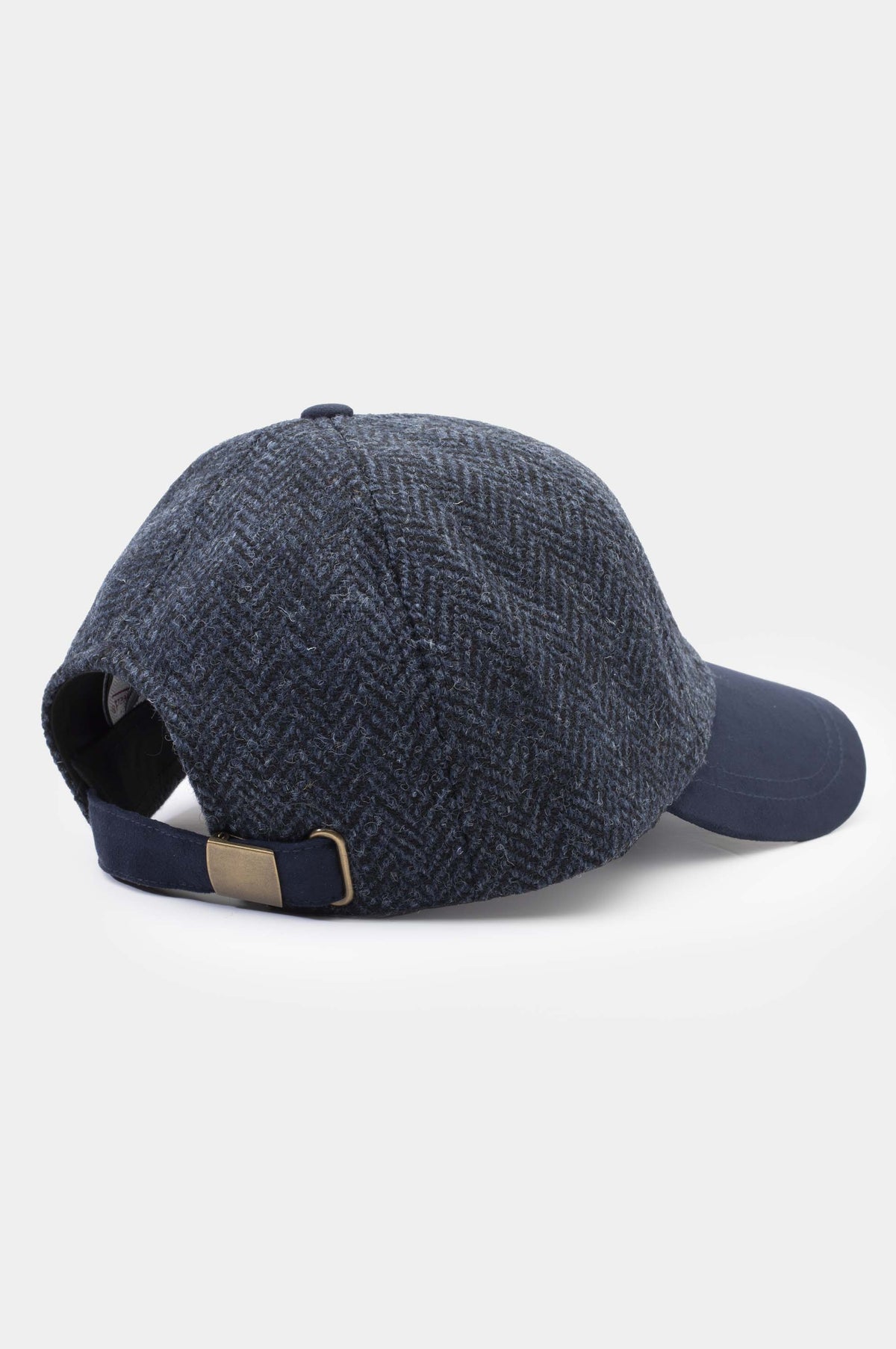 Harris Tweed Baseball Cap in dark navy blue herringbone — back view showing brass adjustable buckle closure and navy strap