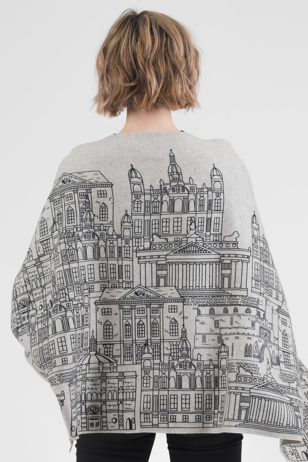 Back view of Skyline Cashmere Double Sided Stole in grey, showing detailed black line-drawn cityscape architecture print