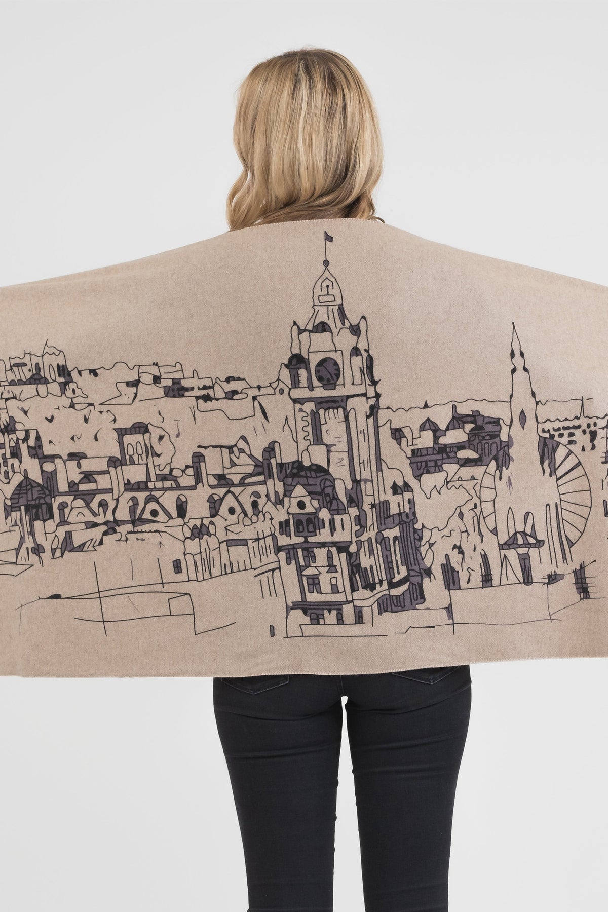 Back view of Skyline Cashmere Double Sided Stole in beige, displaying detailed Edinburgh skyline illustration in dark ink