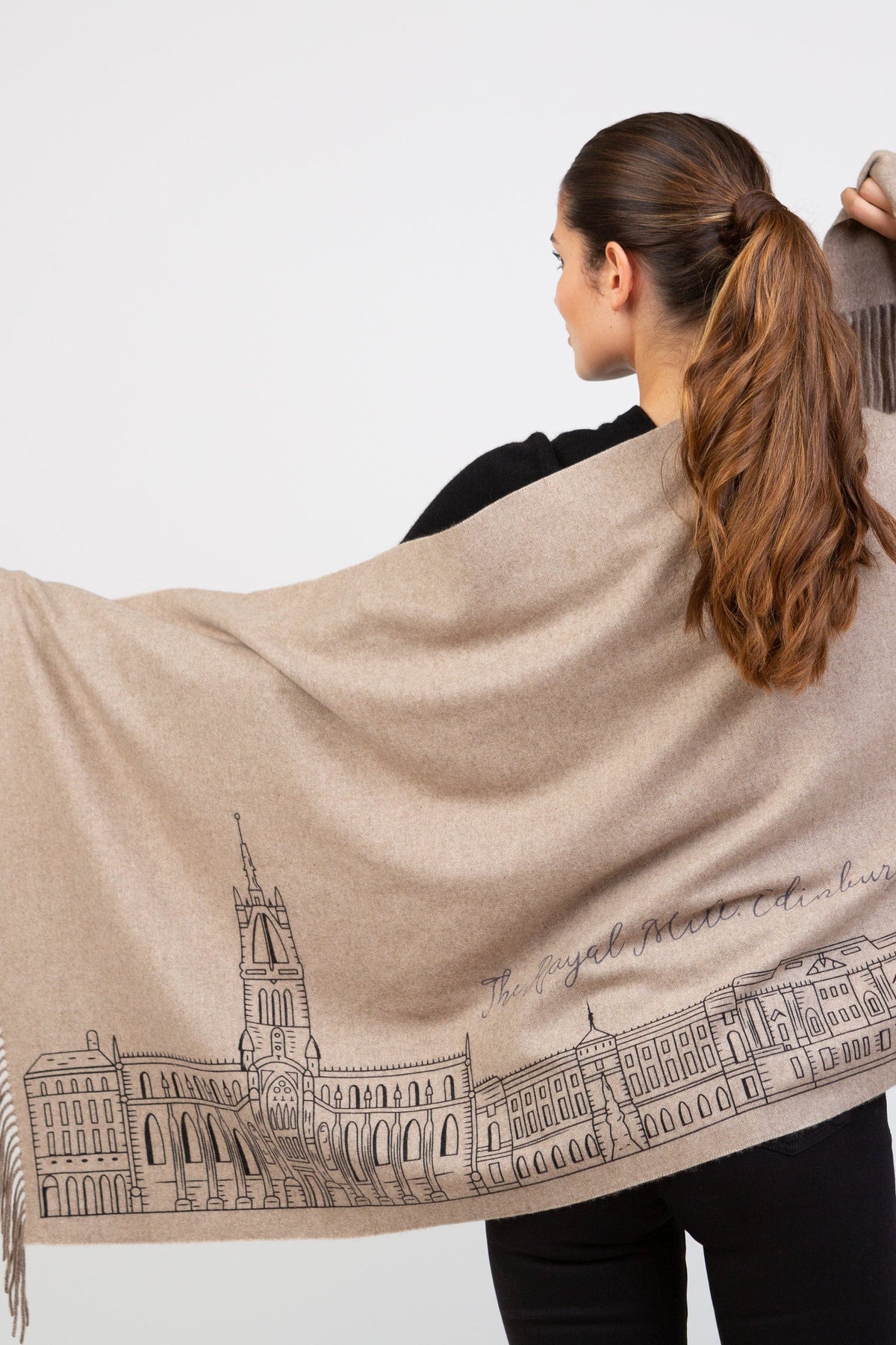 Royal Mile Cashmere Double Sided Stole in beige, back view showing Edinburgh Royal Mile skyline illustration with fringed edge