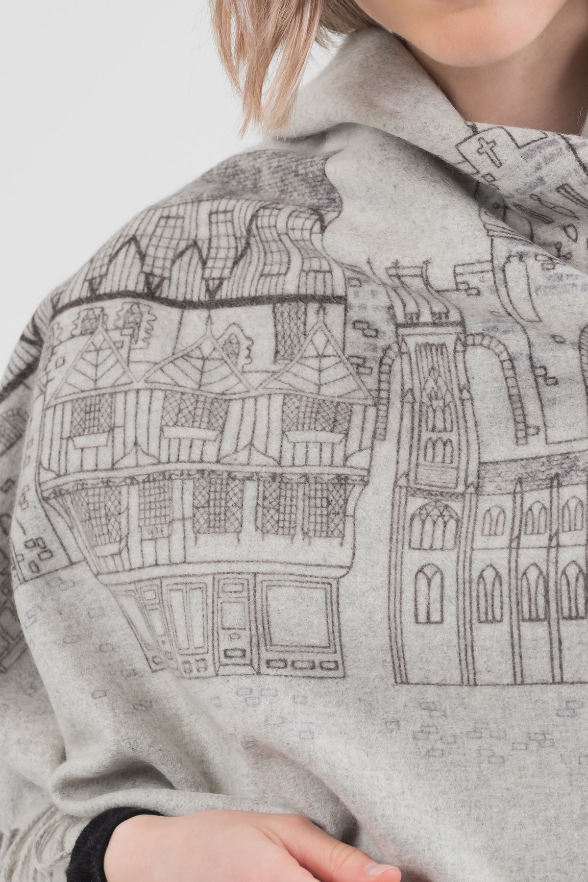 Close-up of City Cashmere Double Sided Stole - York showing detailed architectural sketch print of York buildings on grey cashmere