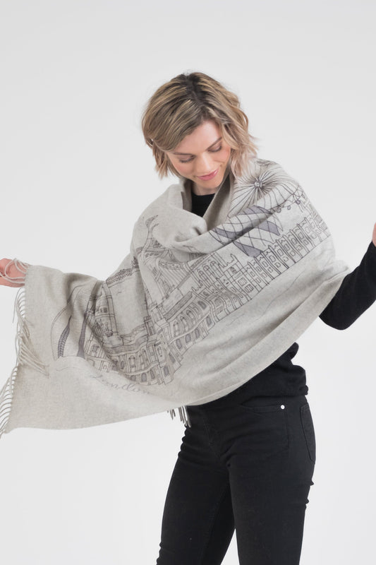 City Cashmere Double Sided Stole - London in light grey, modelled open to show hand-printed London skyline illustration with fringed edges
