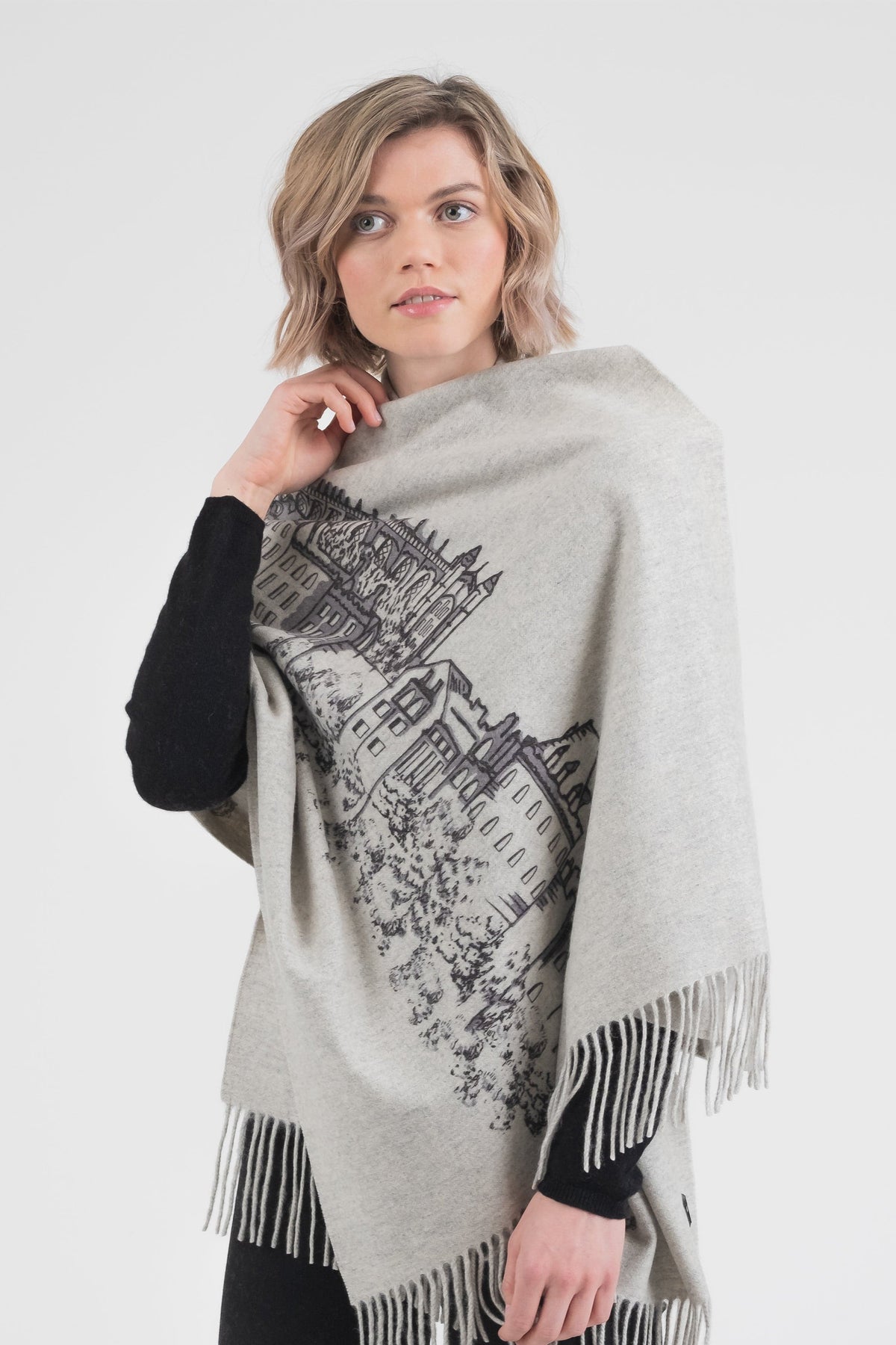 City Cashmere Double Sided Stole - Windsor Castle in light grey with black printed castle illustration, fringed edges, worn draped over shoulders
