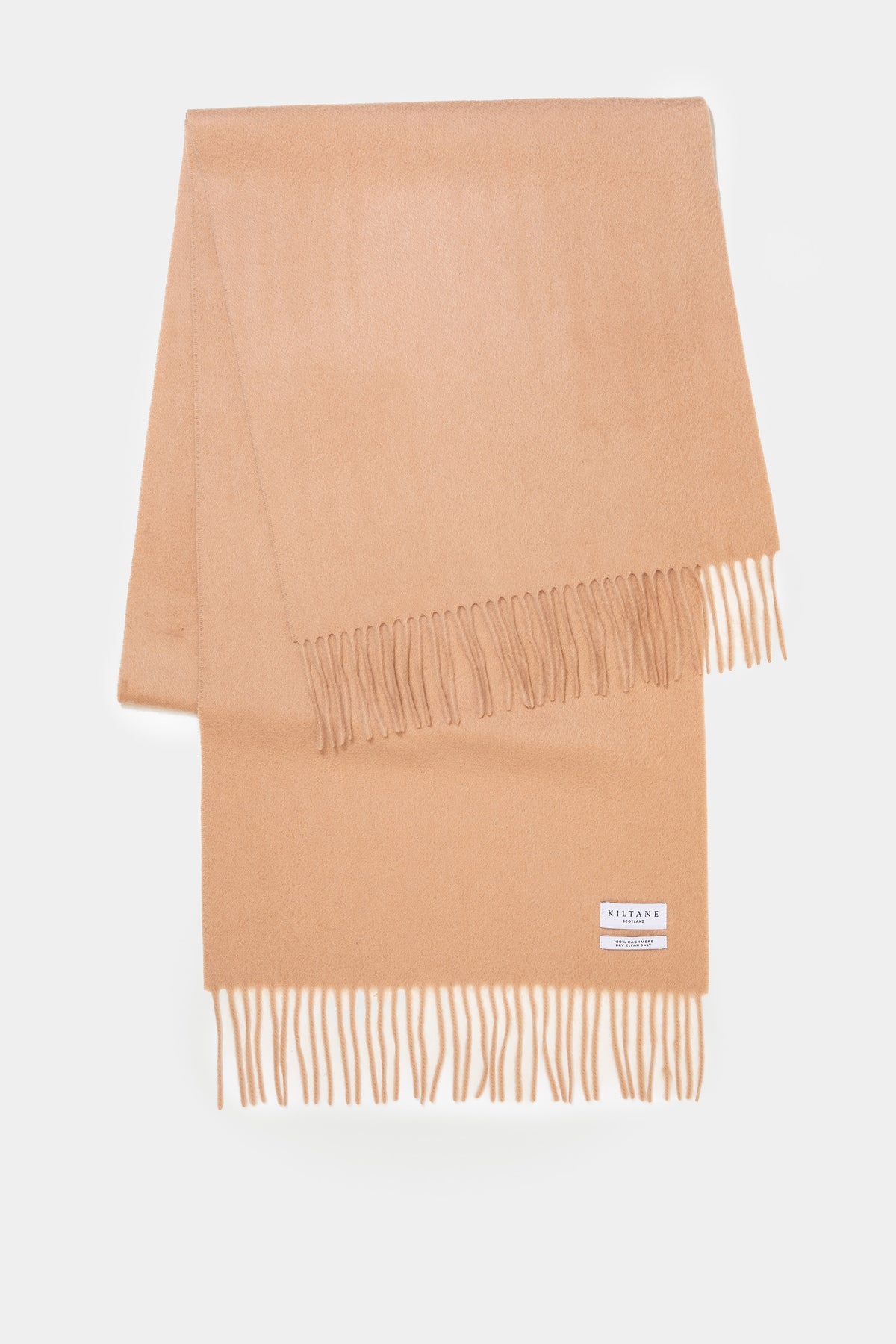 Kiltane Solid Cashmere Wide Scarf in Warm Camel laid flat showing fringed ends and brand label detail