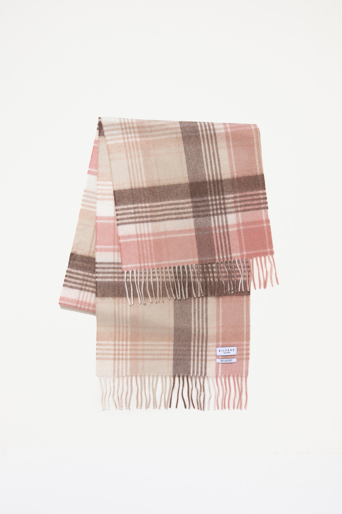 Repeat Edge Cashmere Wide Scarf in Natural folded to display pink, cream, and brown plaid pattern with fringed ends