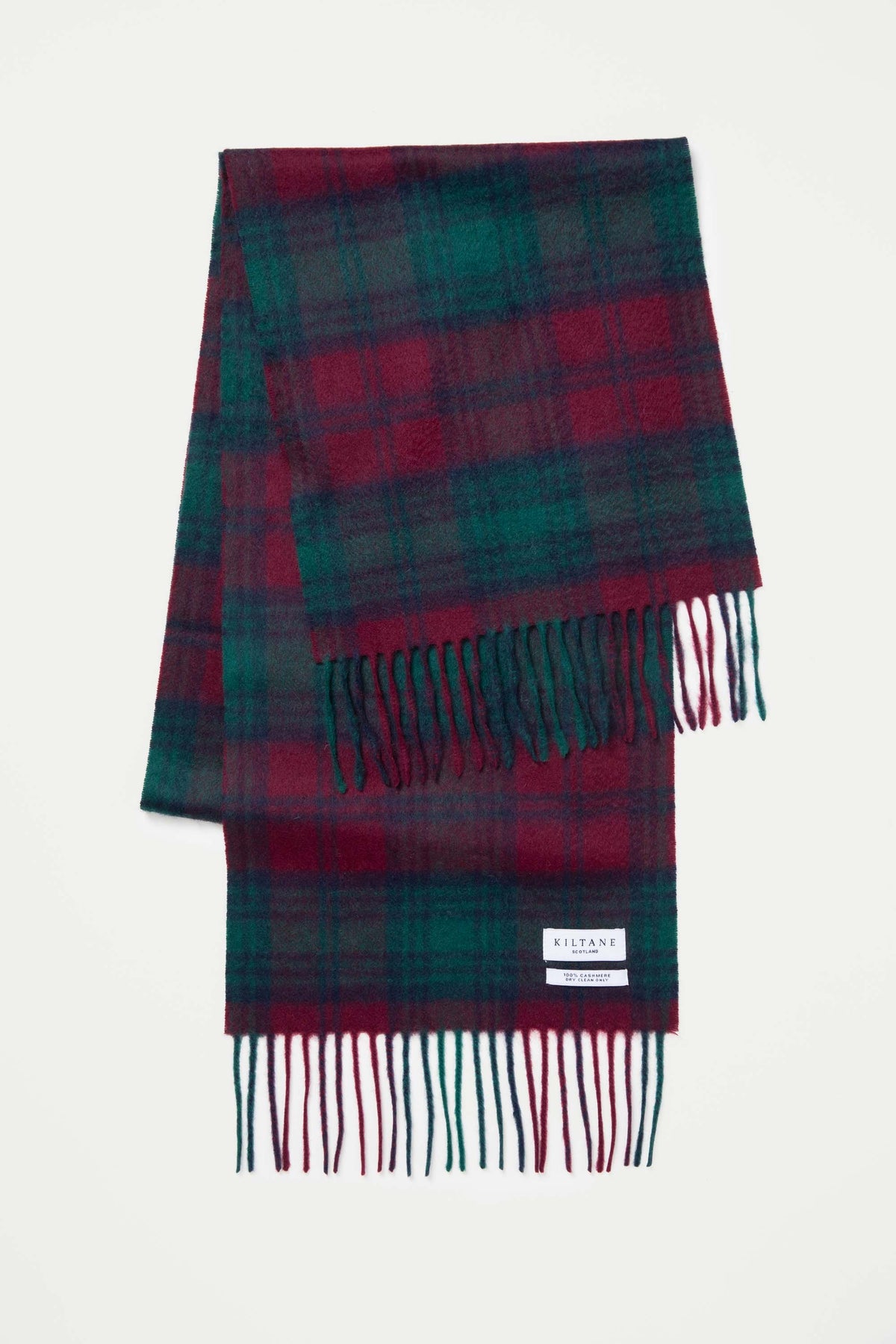 Heritage Tartan Cashmere Scarf - Lindsay folded flat showing deep red and green tartan pattern with fringed ends and Kiltane label