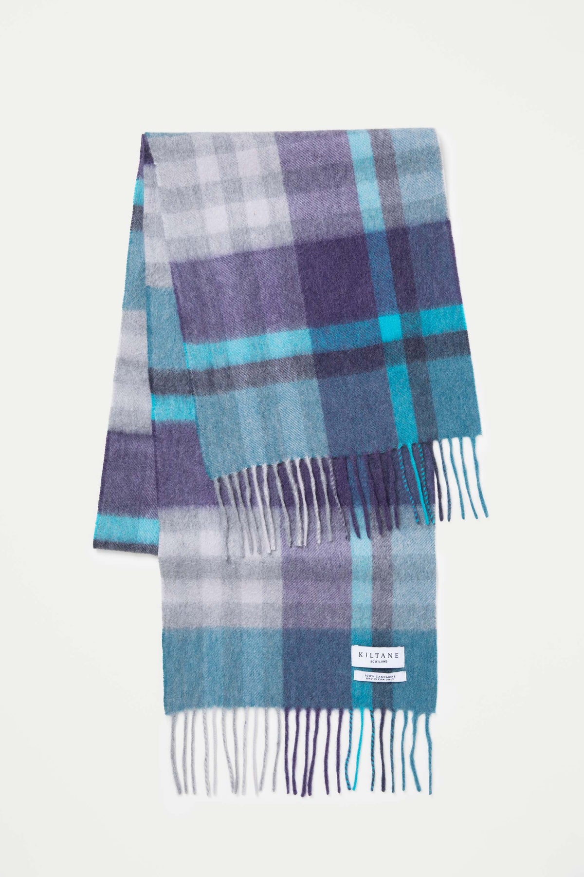 Kiltane Tartan 2 Cashmere Scarf in Blue laid flat showing full plaid pattern in purple, teal, and grey with fringed ends