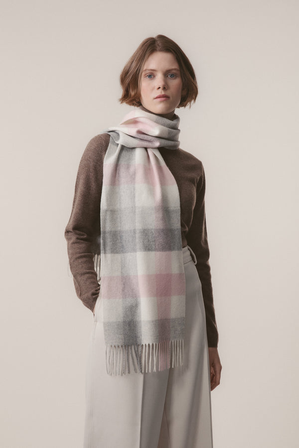 5 Square Check Cashmere Scarf in Cherub, soft pink and grey check pattern with fringed ends, worn looped around the neck