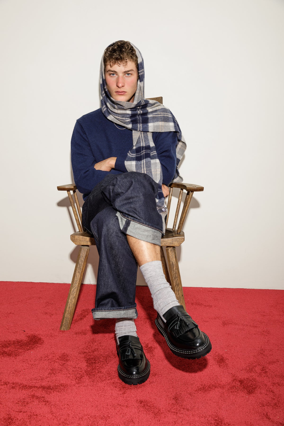 Heritage Tartan Cashmere Wide Scarf in Silver Bannockbane draped over head and shoulder, styled with navy sweater and denim