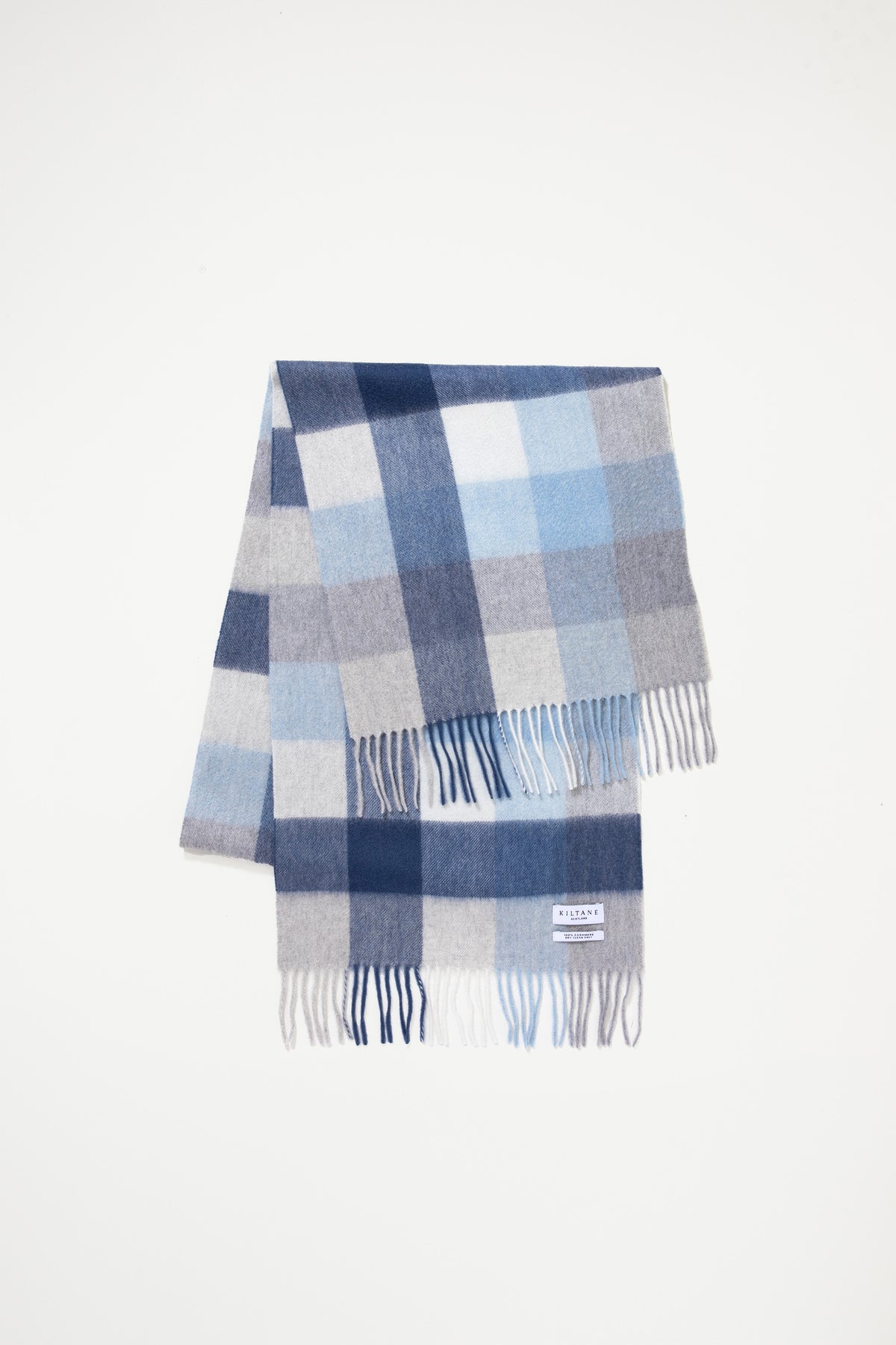 5 Square Check Cashmere Wide Scarf - Glacier laid flat showing blue, navy, and grey check pattern with fringed ends and Kiltane label