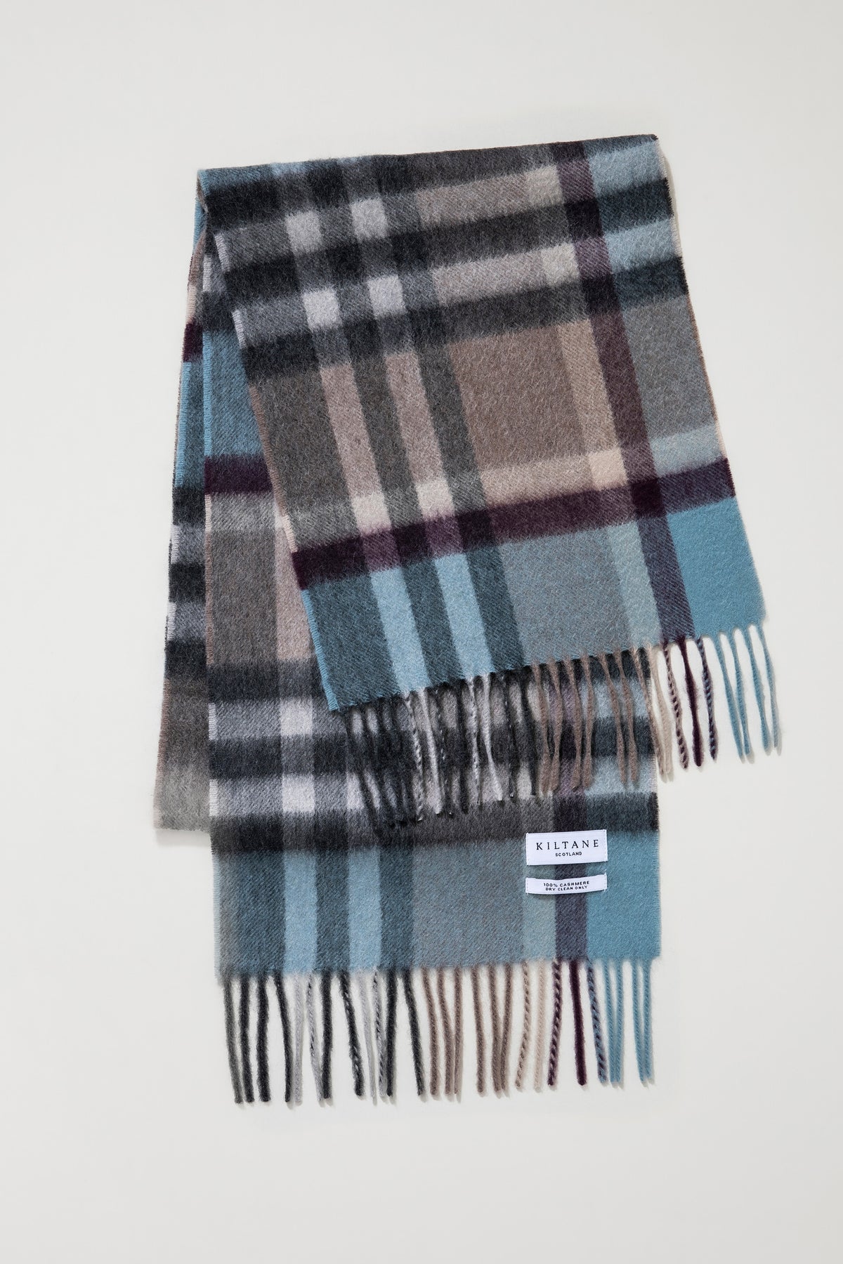 Kiltane Tartan 2 Cashmere Scarf in Blue Taupe folded flat showing full plaid pattern and fringed ends with brand label