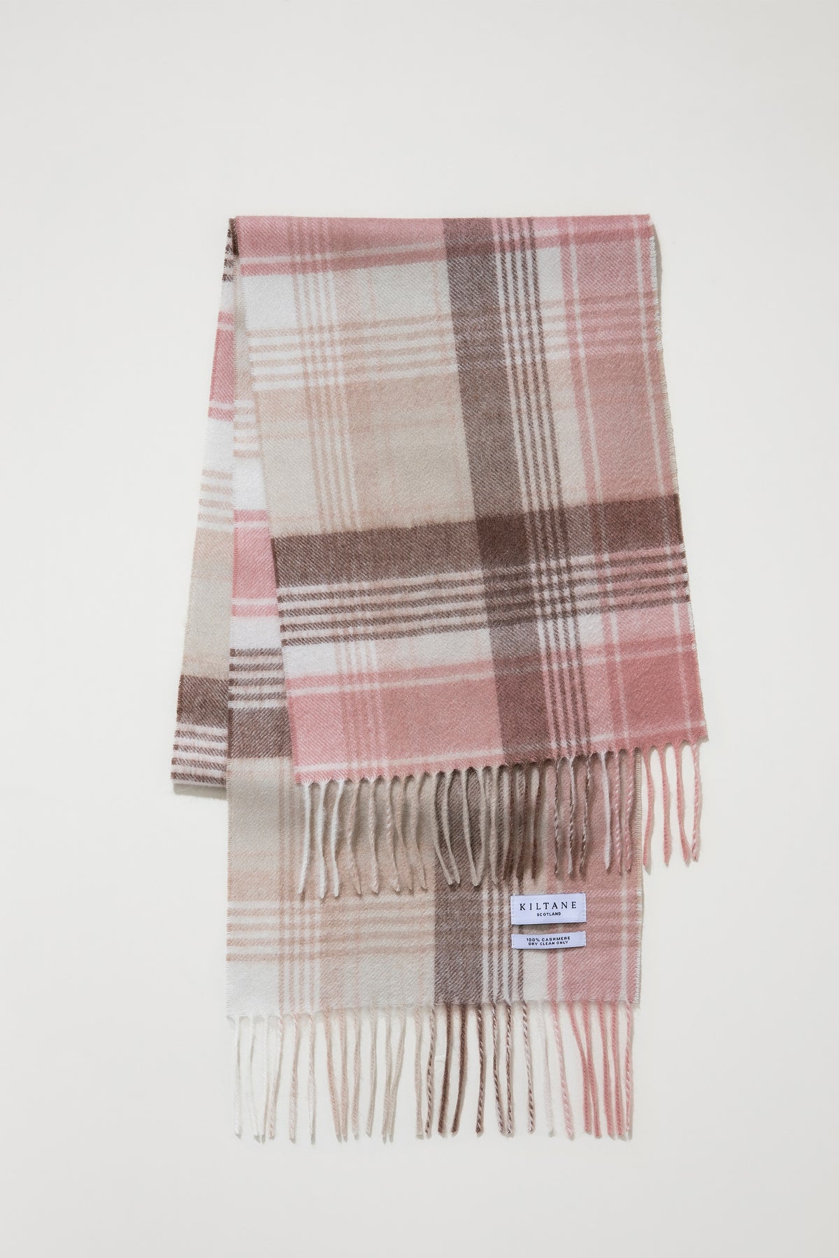 Repeat Edge Cashmere Scarf - Natural folded flat showing pink, cream, and brown plaid pattern with fringed ends and Kiltane label