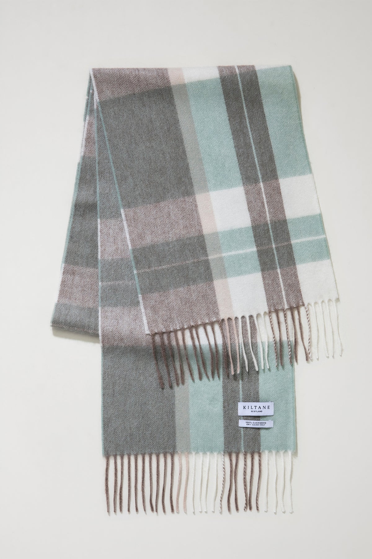 Contemporary Check Cashmere Scarf in Seafoam folded flat showing plaid pattern in mint, grey, and cream with fringed ends