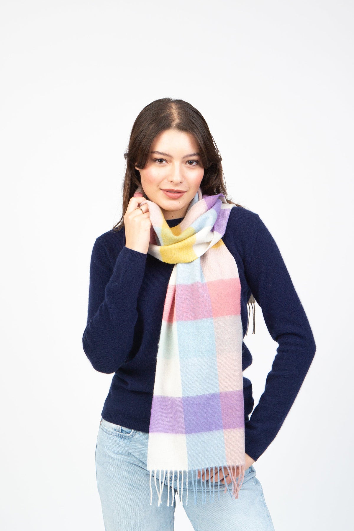 3 Square Cashmere Scarf in Candy colourway worn looped around the neck, showing pastel pink, blue, lilac, and yellow check pattern with fringe
