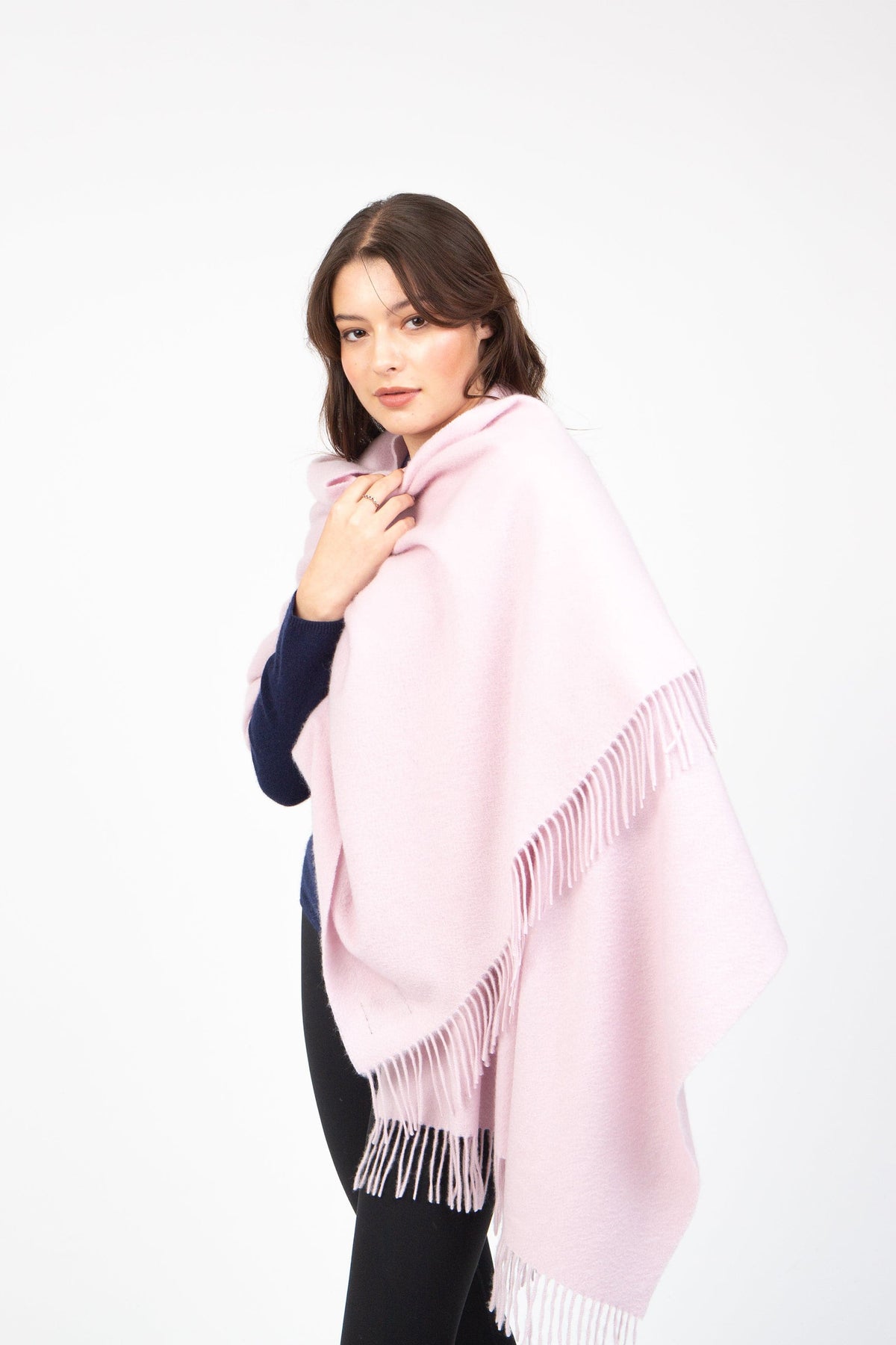 Solid Cashmere Stole in Pale Lilac draped over model's shoulders, showing soft wool texture and fringed edges