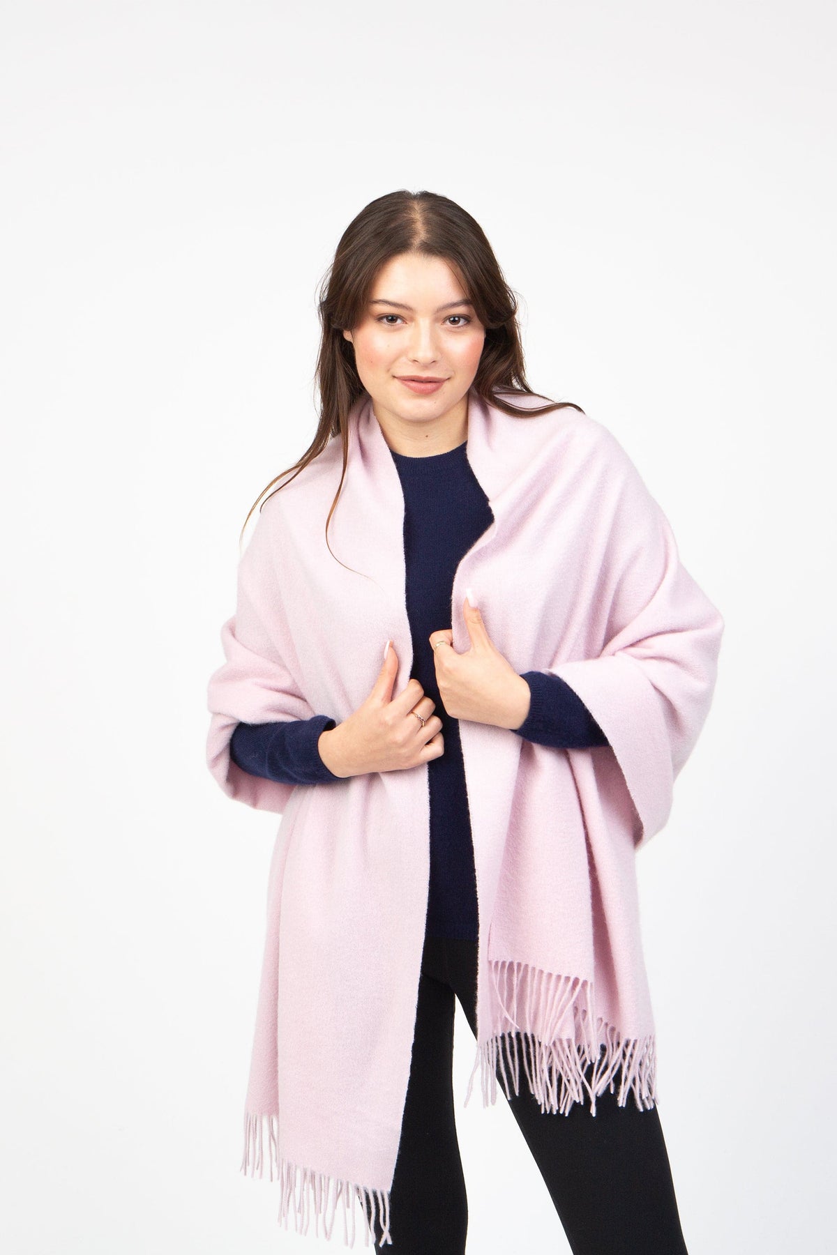 Model wearing the Solid Cashmere Stole in Pale Lilac draped over shoulders, showing soft texture and fringed ends
