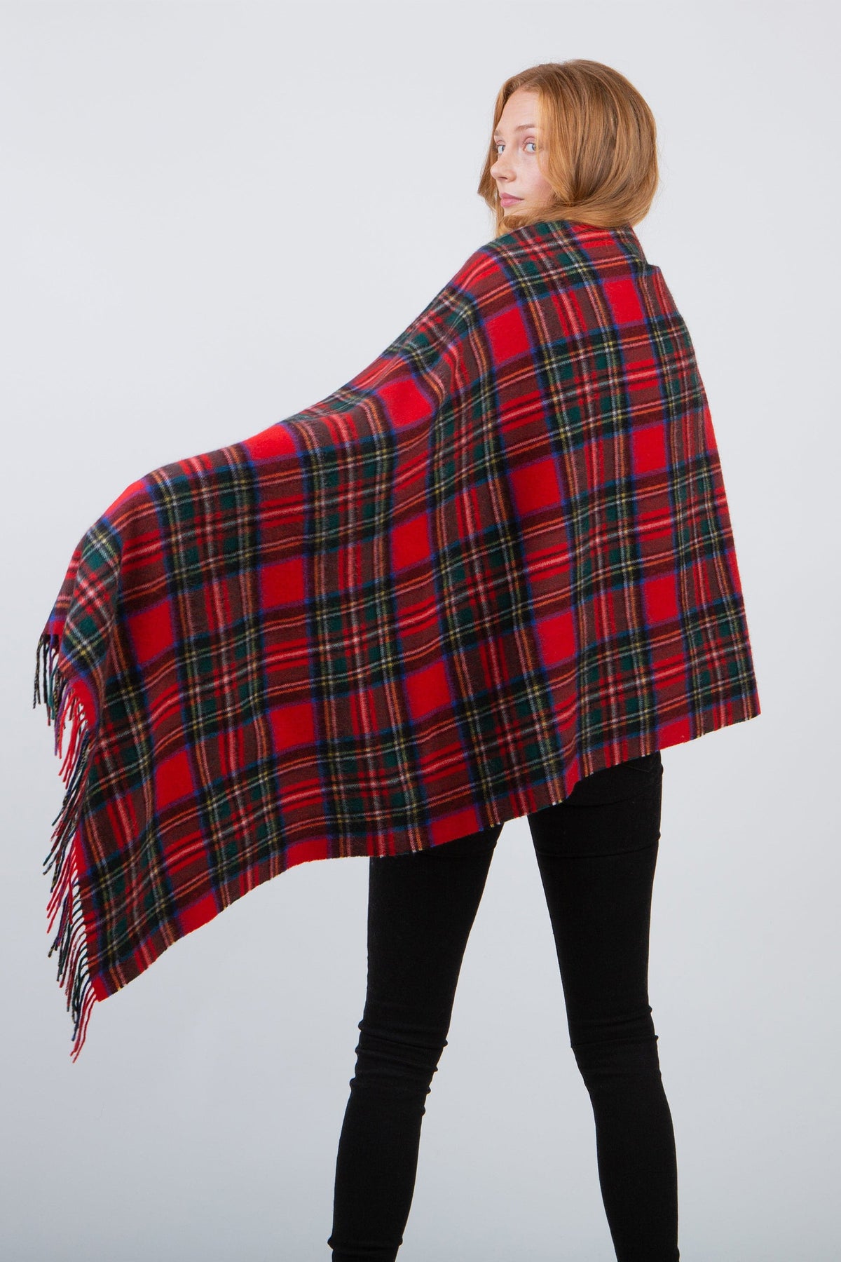 Heritage Tartan Cashmere Stole in Royal Stewart draped across a model's back, showing full tartan pattern and fringed edges